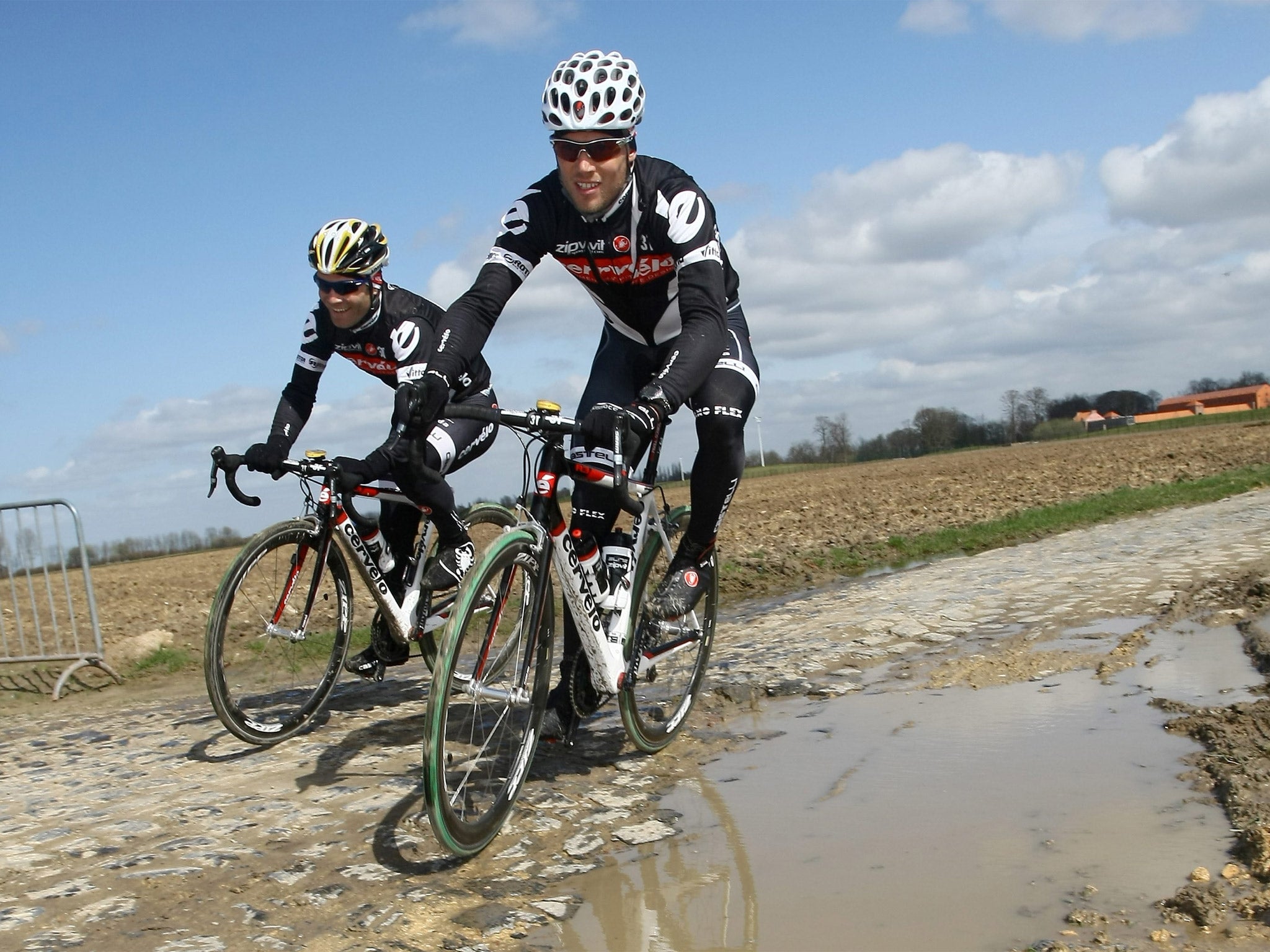Roger Hammond (left) and Thor Hushovd ride over the cobbles during a Paris-Roubaix training session