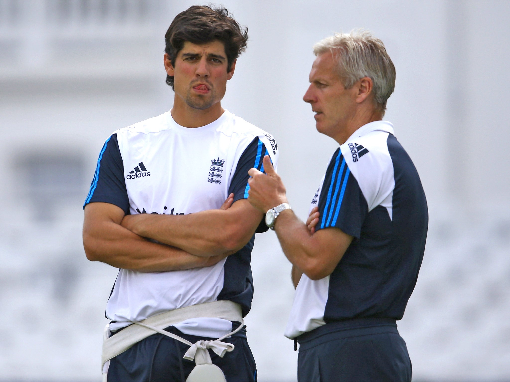 England captain Alastair Cook talks to coach Peter Moores