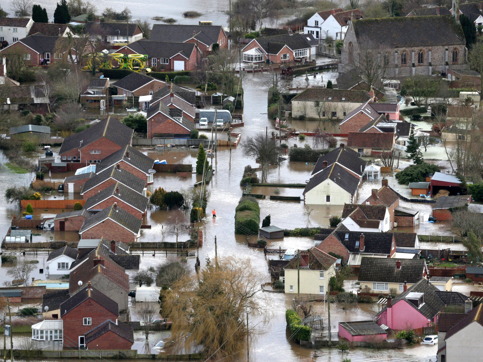 Water surrounds flooded properties in the village of Moorland on the Somerset Levels, earlier this year