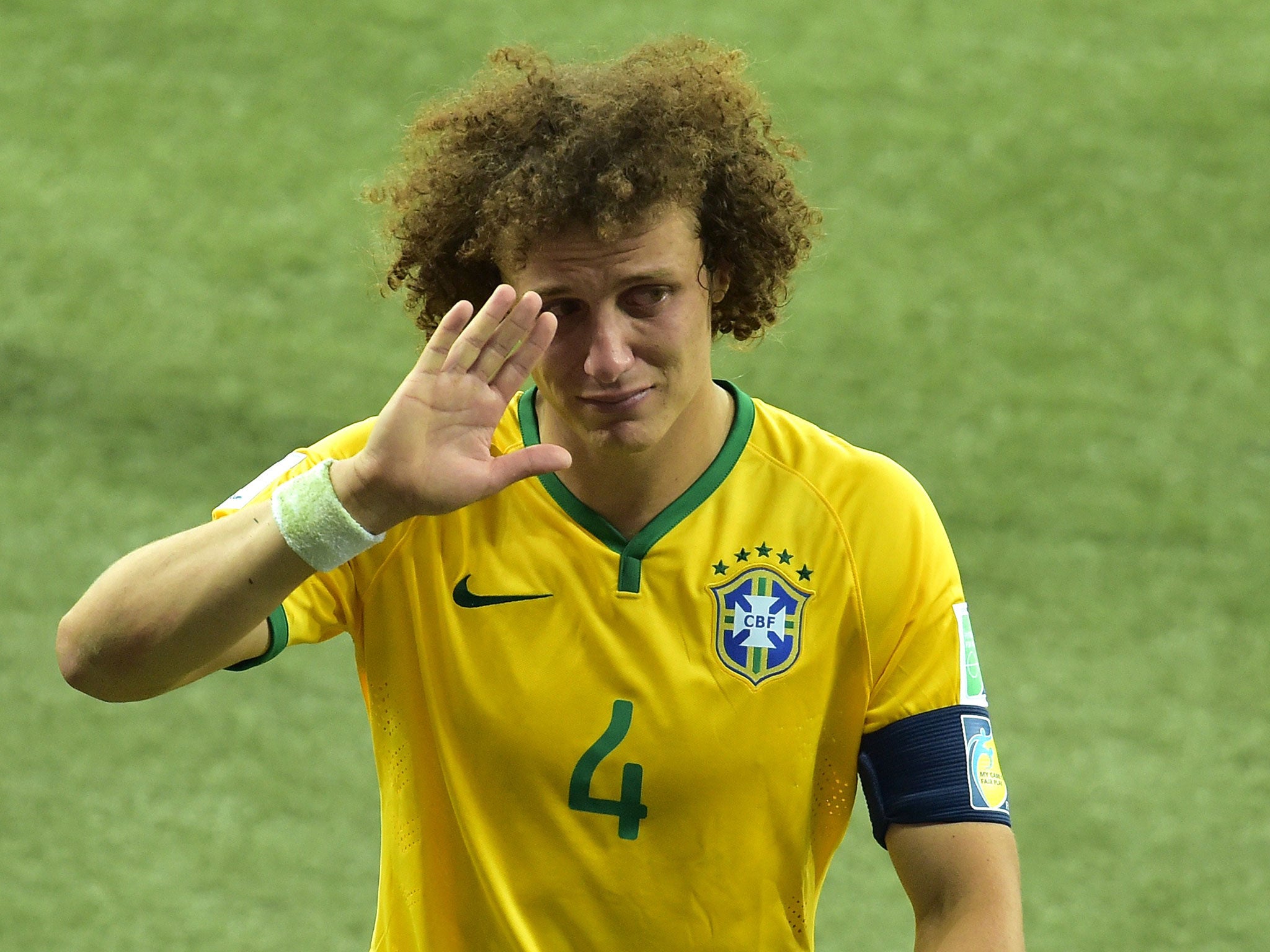 A tearful David Luiz leaves the field