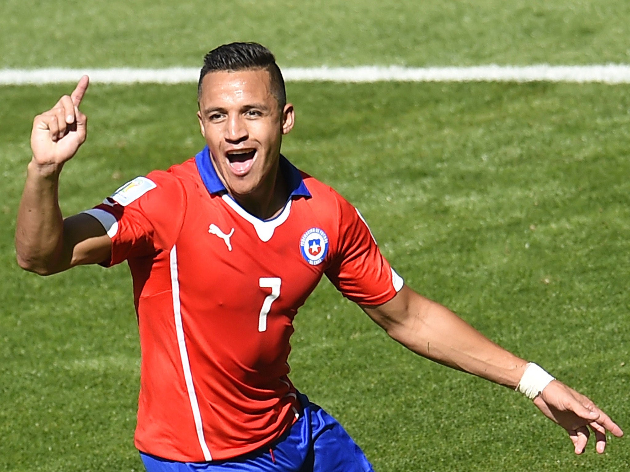 Chile forward Alexis Sanchez celebrates scoring against Brazil