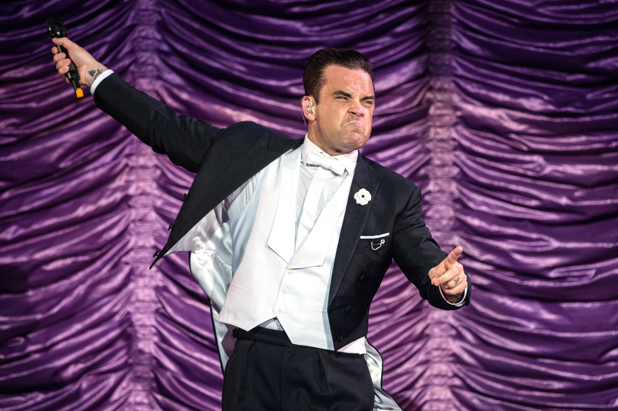 Robbie Williams performs during his 'Swing Both Ways' World Tour