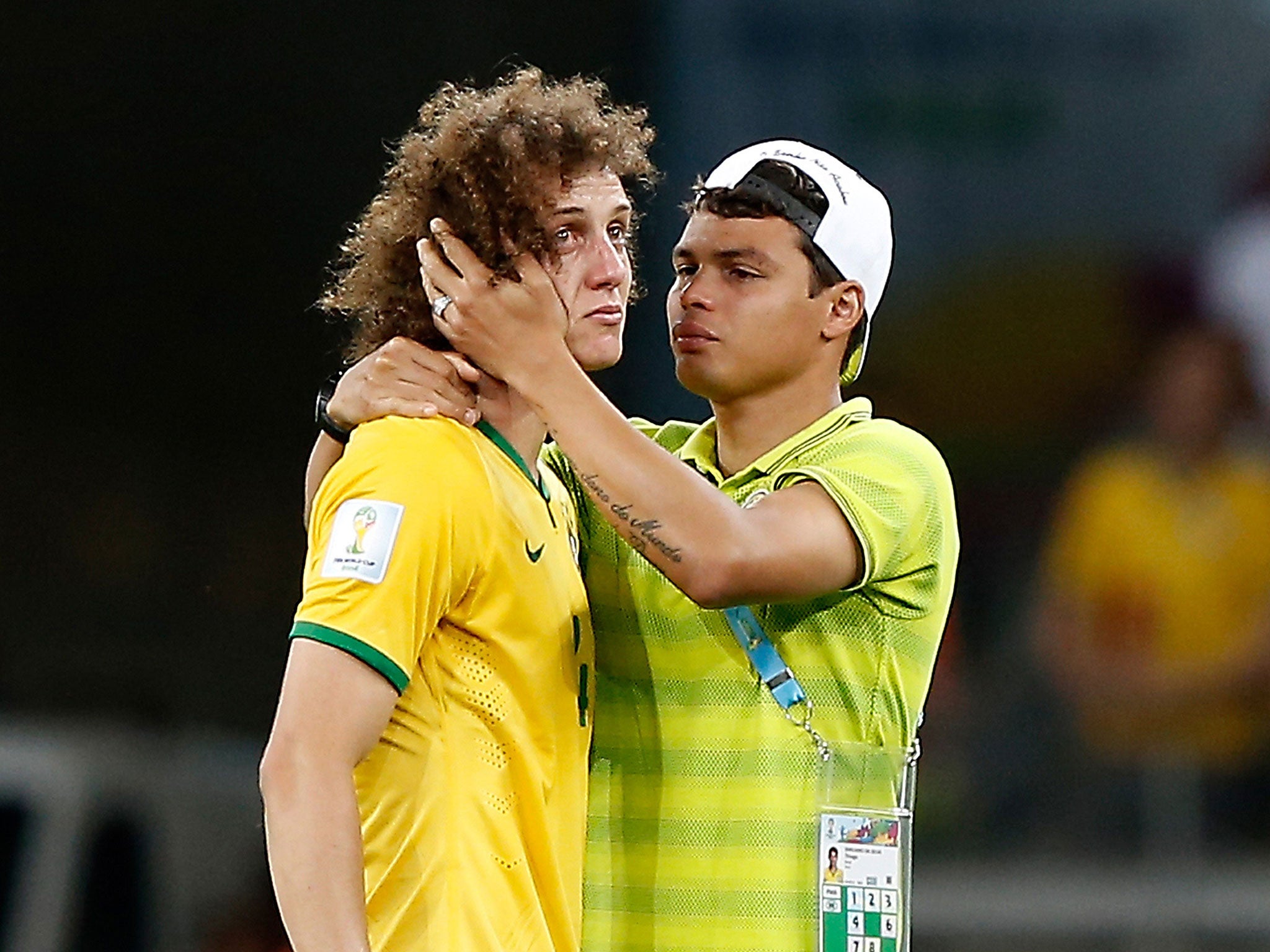David Luiz is consoled by Thiago Silva after the 7-1 defeat at the hands of Germany