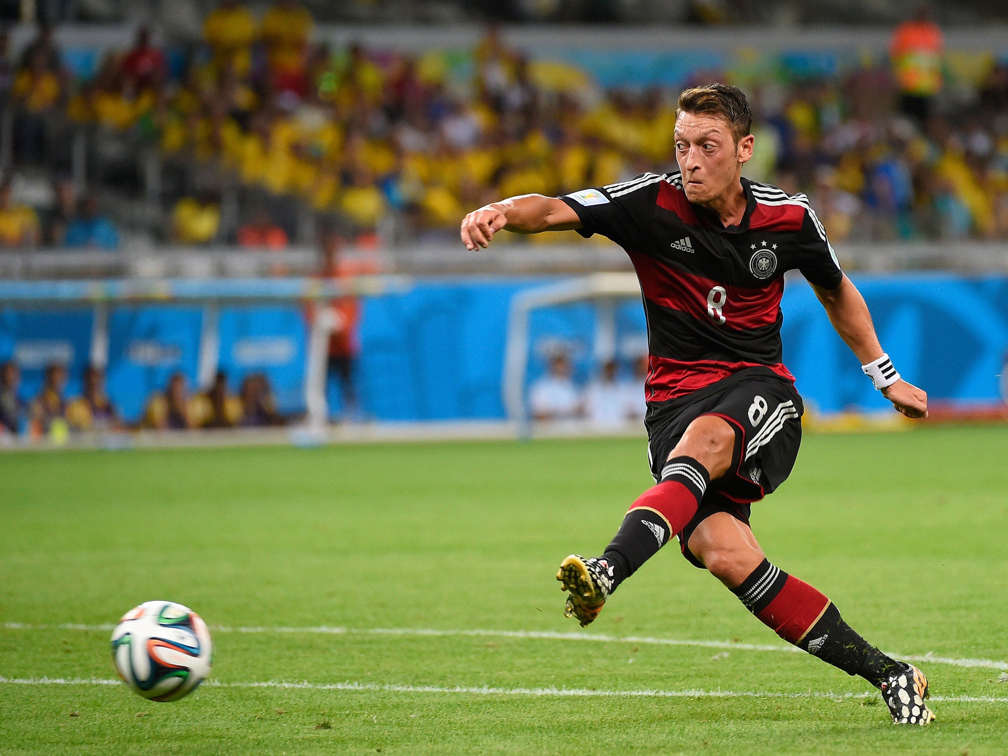 Mesut Ozil has an effort on goal, which drifts agonisingly wide of the post
