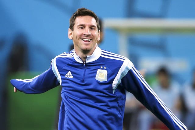 Argentina's national soccer team player Lionel Messi warms up during their training session in Sao Paulo 