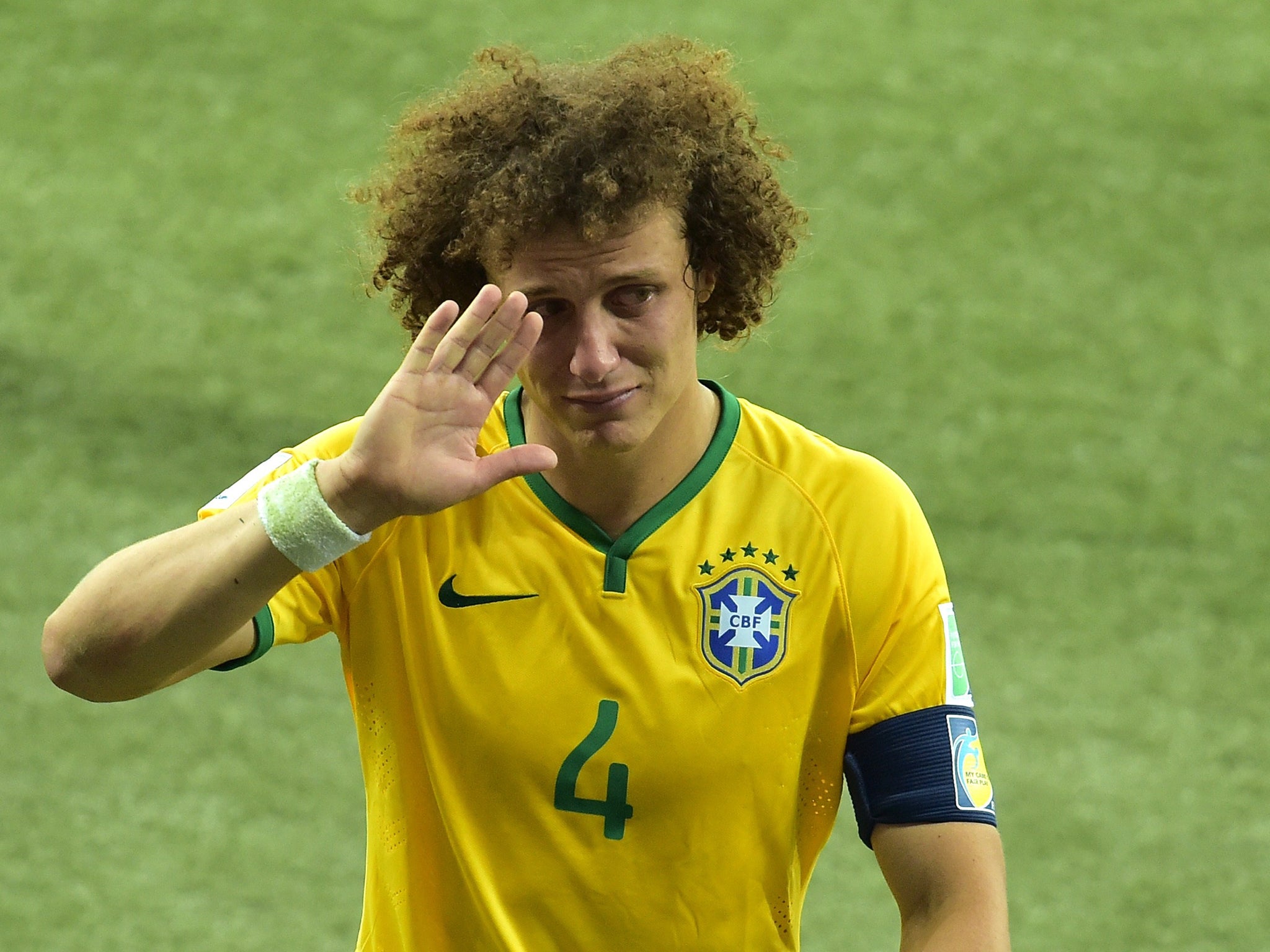 Brazil's defender David Luiz walks off the pitch after losing the semi-final football match between Brazil and Germany at The Mineirao Stadium in Belo Horizonte, during the 2014 FIFA World Cup  