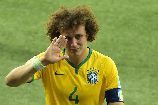 Brazil's defender David Luiz walks off the pitch after losing the semi-final football match between Brazil and Germany at The Mineirao Stadium in Belo Horizonte, during the 2014 FIFA World Cup  