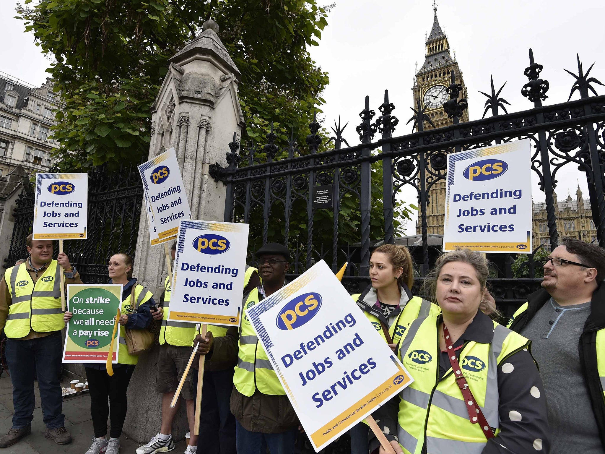 PCS members stand outside the Houses of Parliament