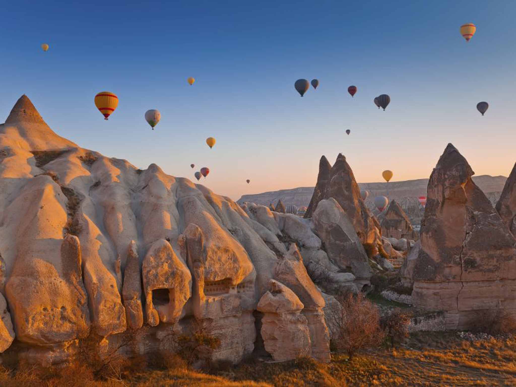 Tourism soars: hot air balloons over caves in Cappadocia