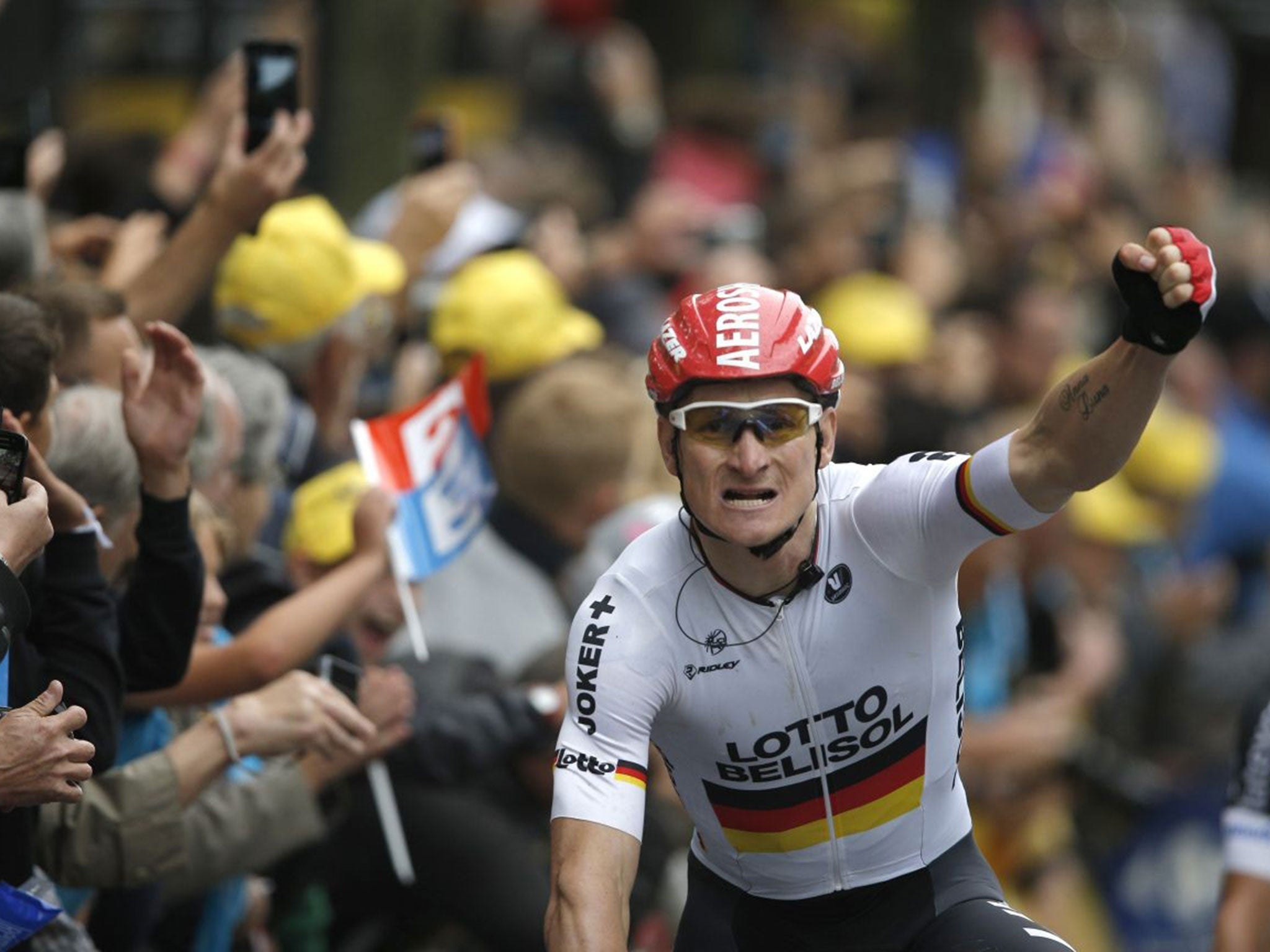 Germany's Andre Greipel crosses the finish line to win the sixth stage of the Tour de France cycling race over 194 kilometers (120.5 miles) with start in Arras and finish in Reims, France