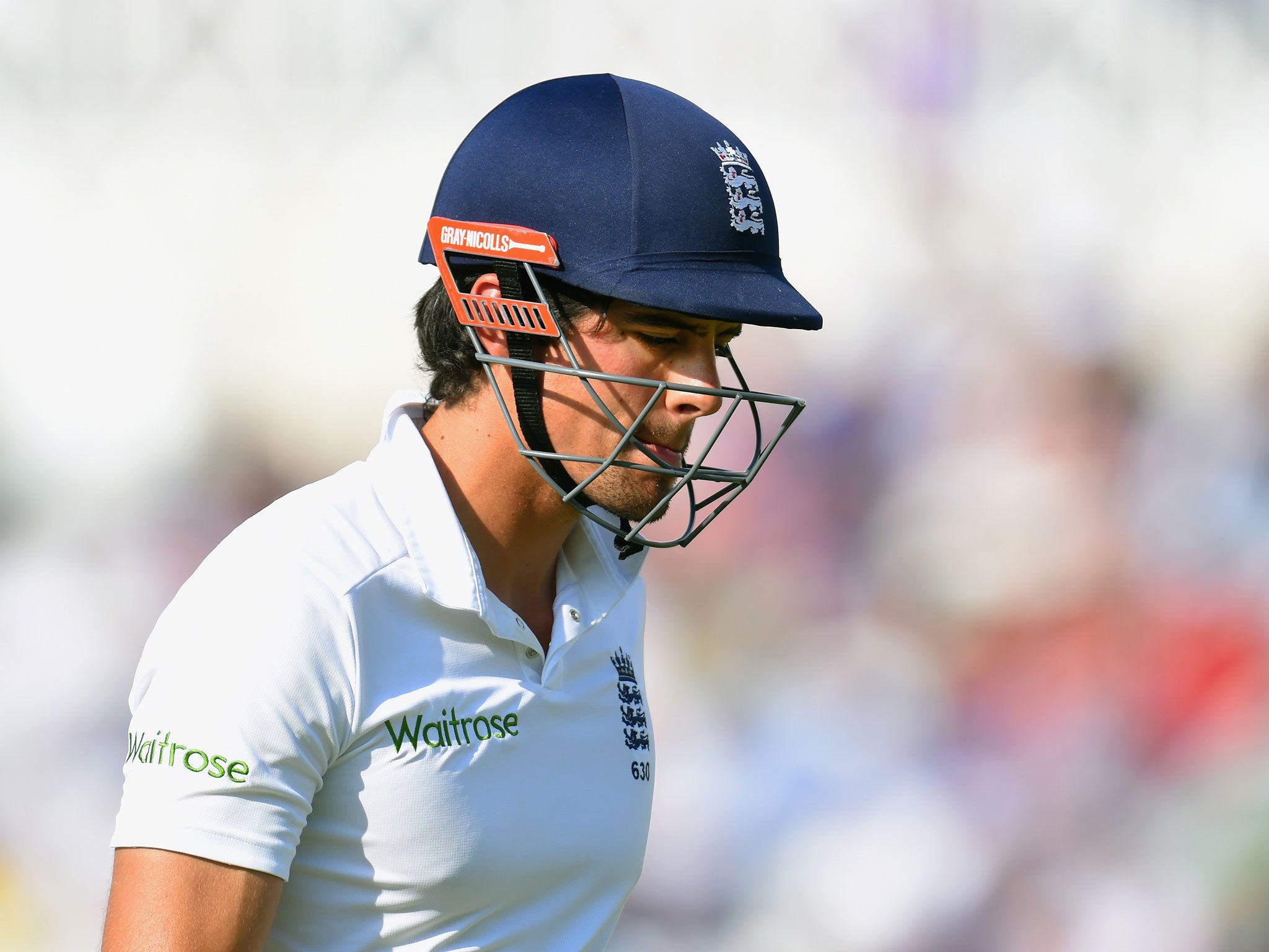 England captain Alastair Cook leaves the crease after being bowled by Mohammed Shami for 5