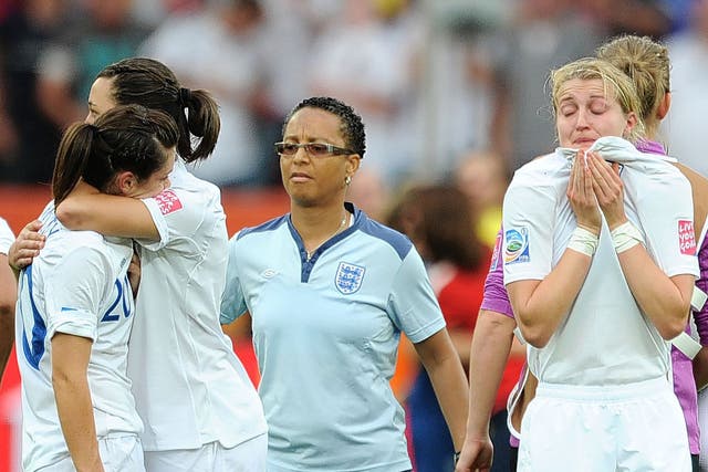 Dejection for Hope Powell (centre) and the England players after their penalty shoot-out defeat to France at the 2011 Women’s World Cup