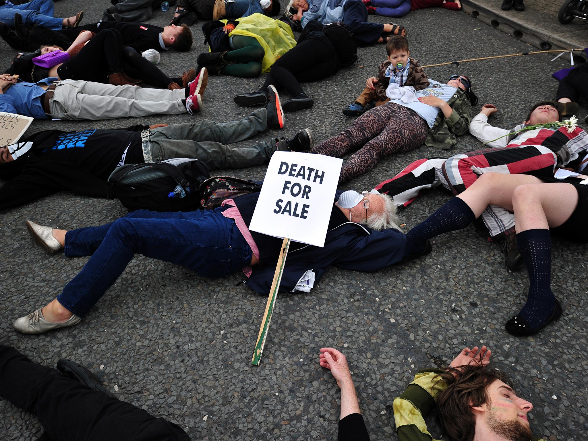 Protestors lie in the road during a demonstration against an arms fair at the ExCeL Centre back in September last year