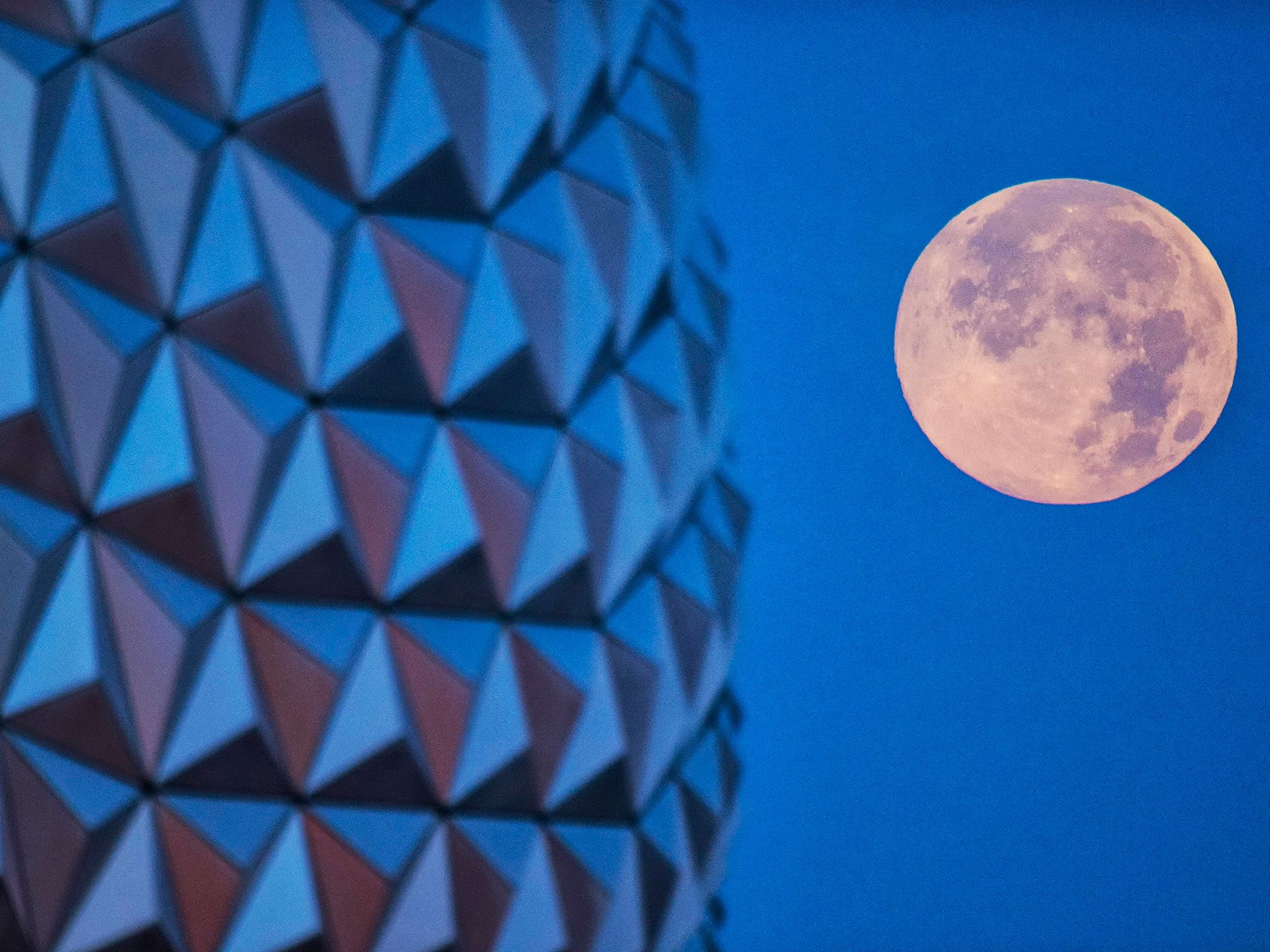 In this handout photo provided by Disney Parks, the 'supermoon' is seen with the Epcot center geodesic sphere in the foreground on June 23, 2013 at Walt Disney World Resort in Lake Buena Vista, Florida. This 'supermoon' is the closest and largest full moo