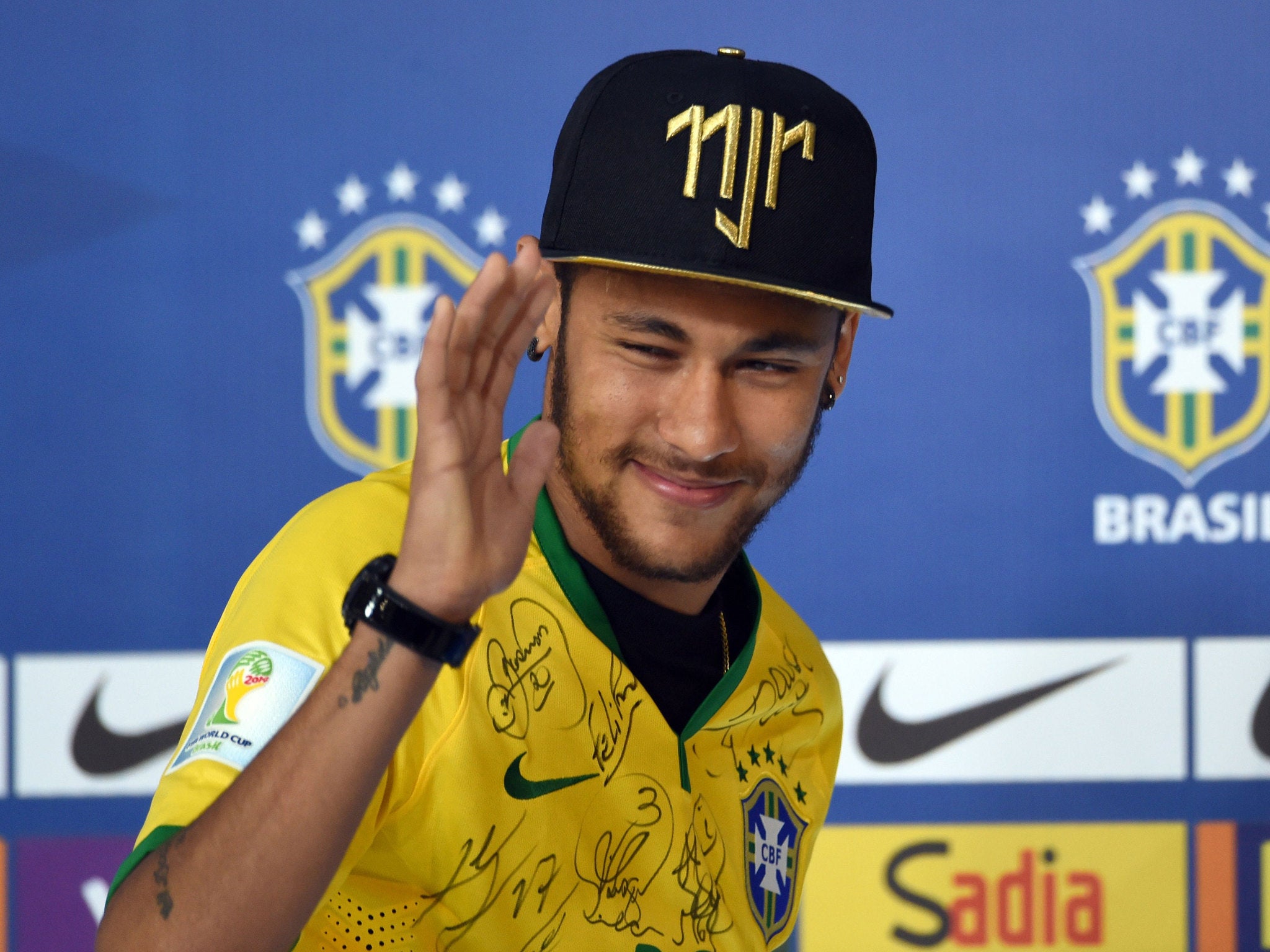 Brazil's forward Neymar gestures during a press conference in Teresopolis on July 10, 2014, during the FIFA World Cup.