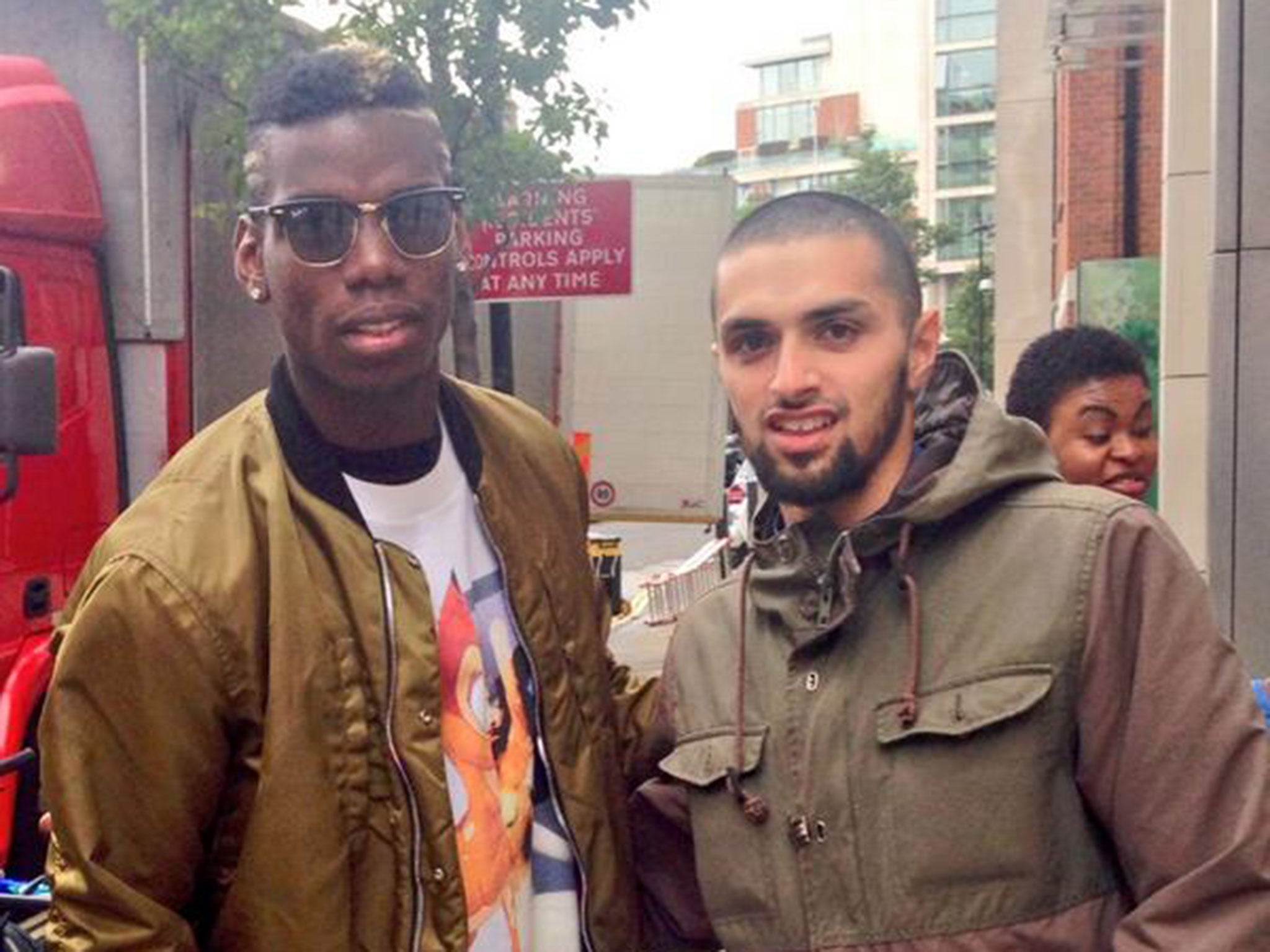 Paul Pogba pictured with a fan in London on Thursday