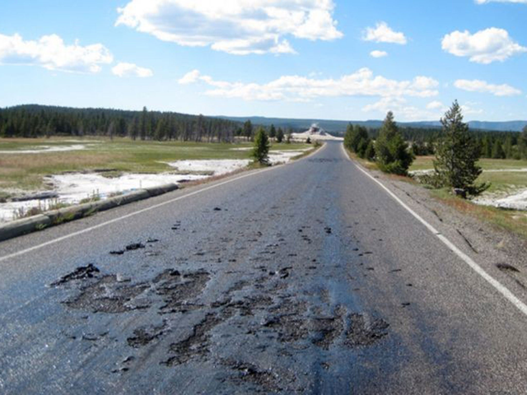Damage to a Yellowstone National Park road caused by thermal features in the park in Wyoming.
