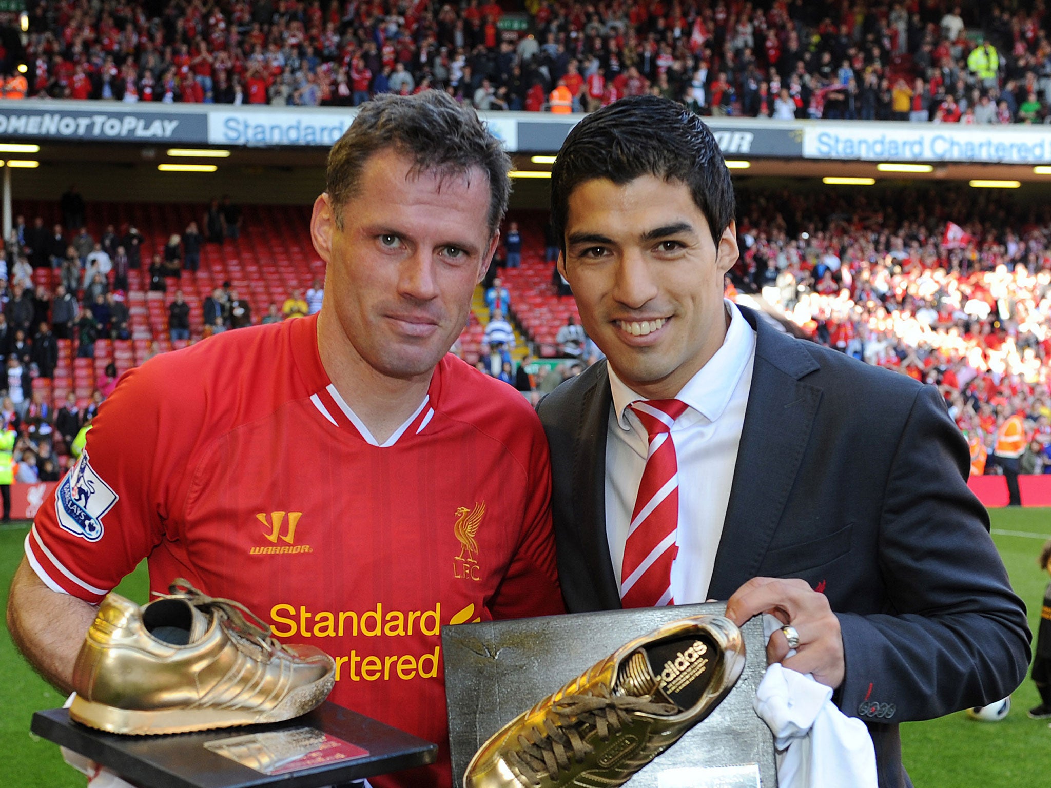 Jamie Carragher and Luis Suarez of Liverpool pose at the end of the Barclays Premier League match