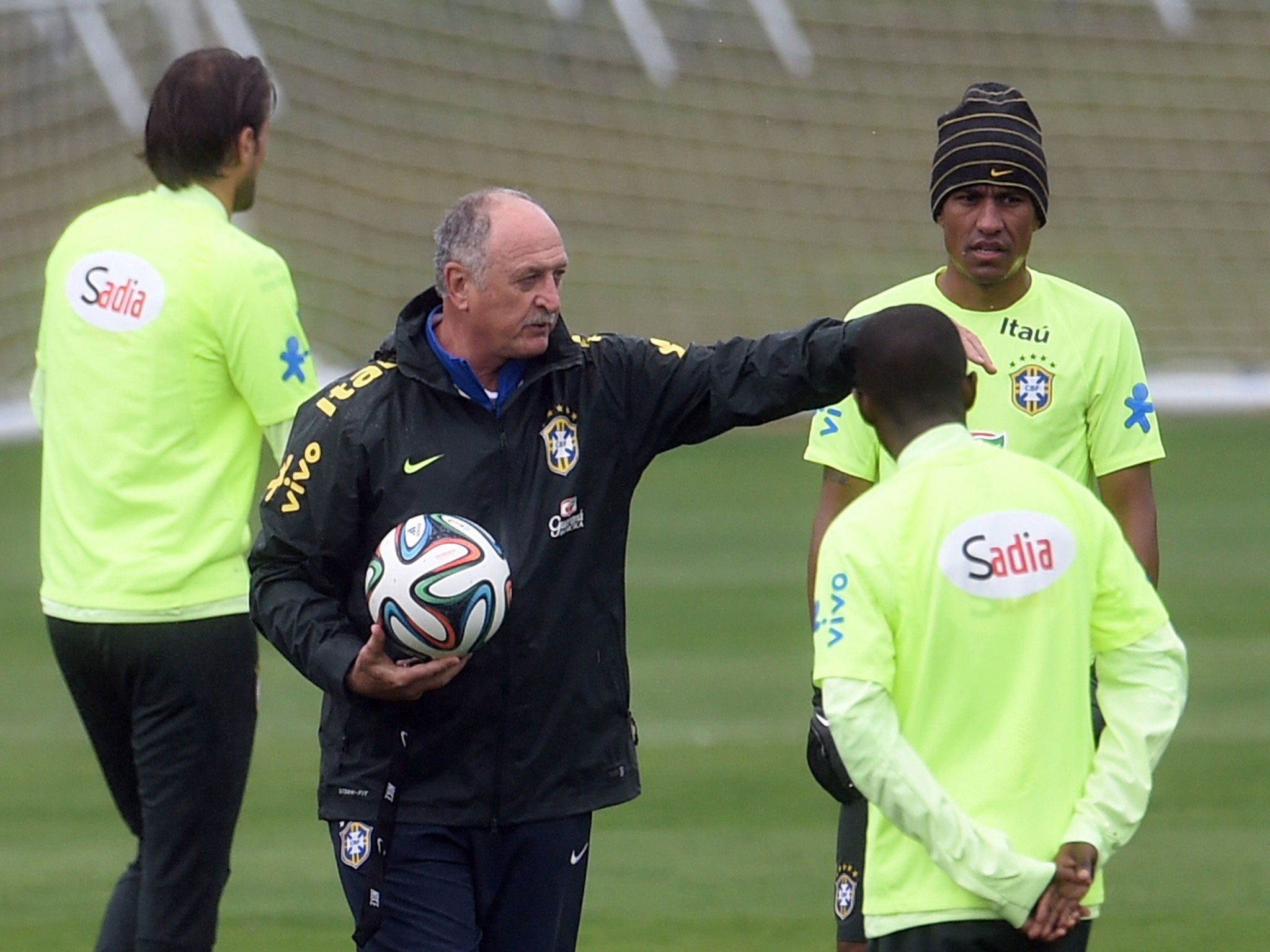 Brazil's coach Luiz Felipe Scolari speaks with players as they take part in a training session