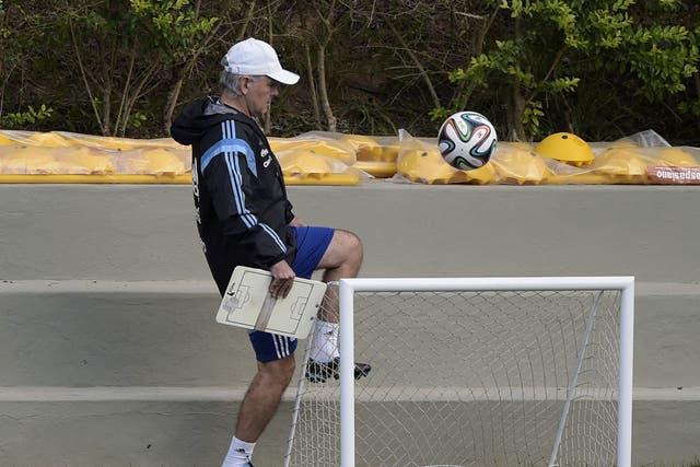 Argentina's coach Alejandro Sabella juggles a ball during a training session