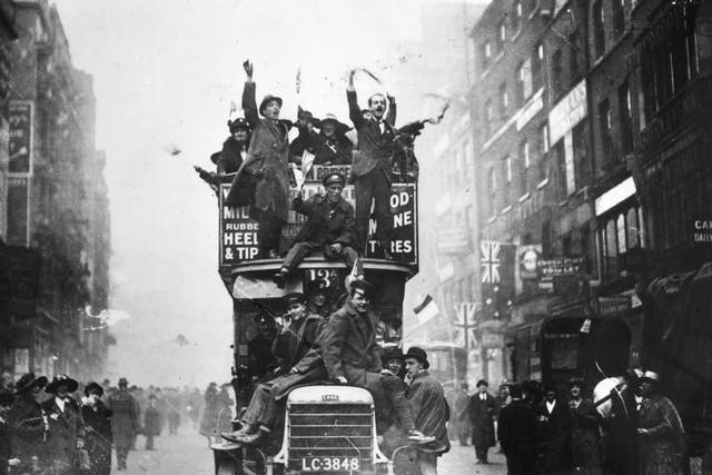 Crowds in London celebrate the end of hostilities in 1918