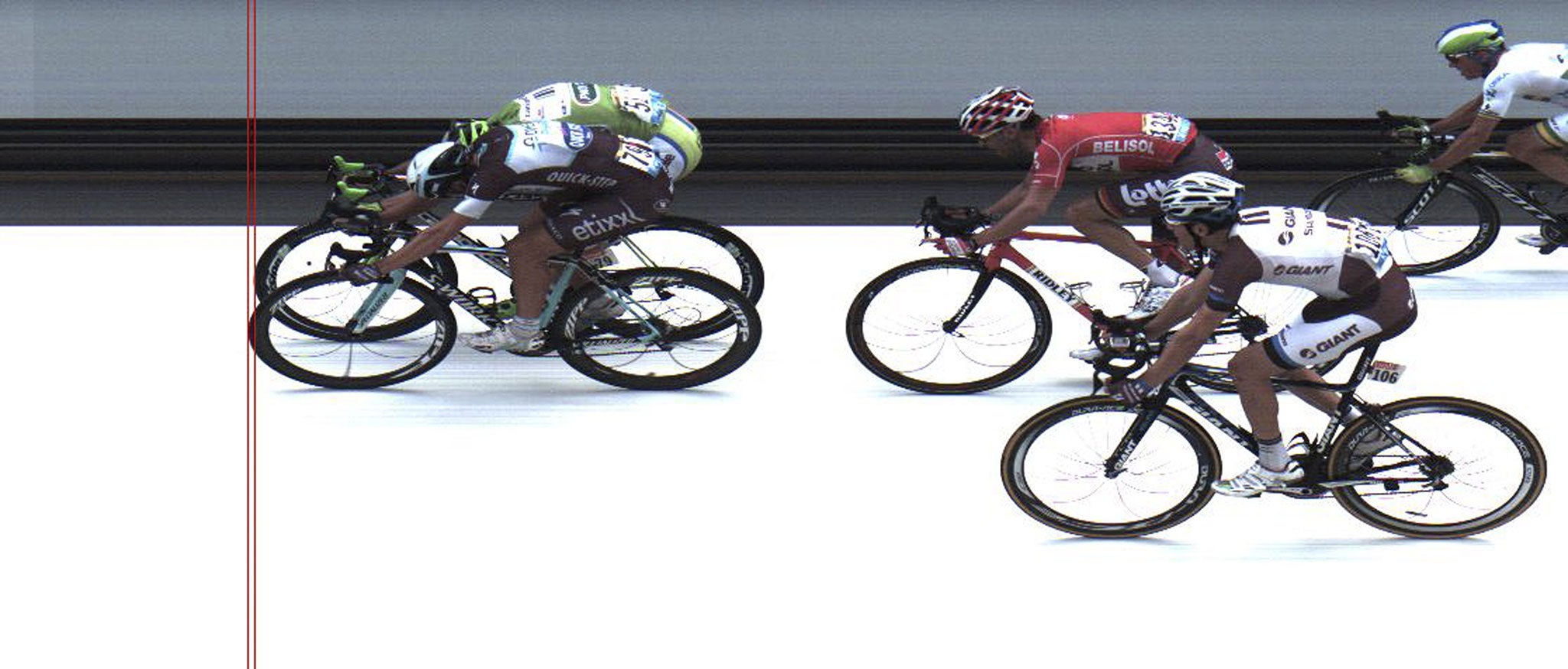 In this photo finish image, Italy’s Matteo Trentin (front left) crosses the finish line ahead of second-placed Peter
Sagan, of Slovakia (left rear). France’s Tony Gallop in red is third, and Netherlands’ Tom Dumoulin in white, fourth