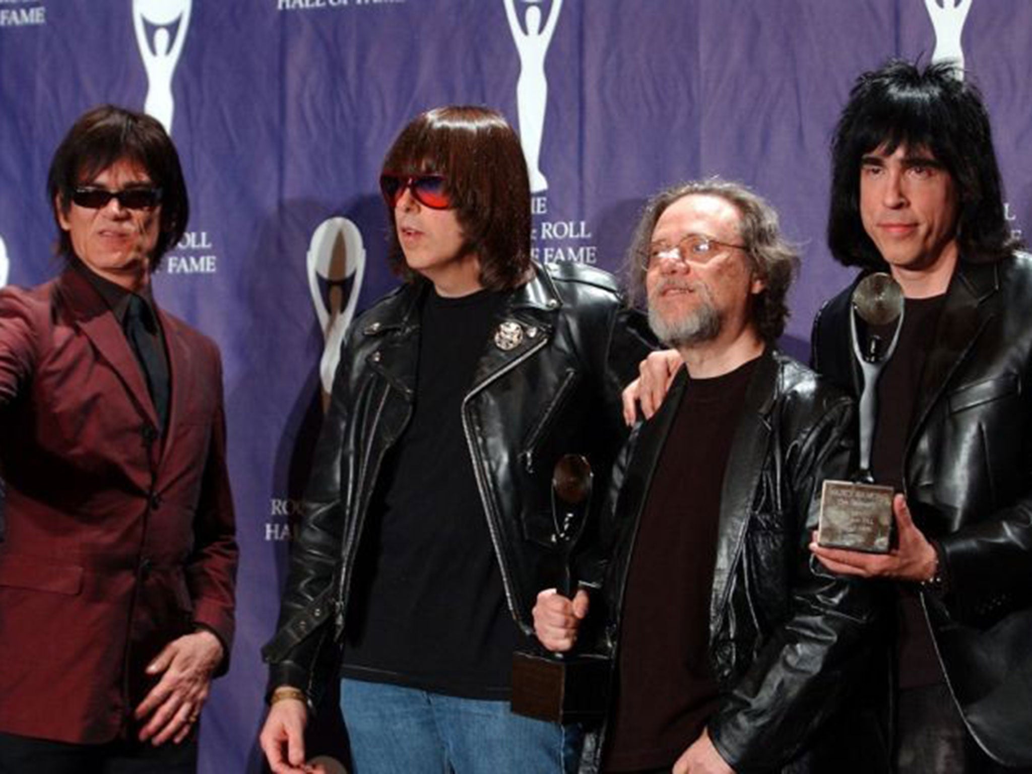 Tommy Ramone (second from right) getting inducted into the Rock and Roll Hall of Fame with the Ramones in 2002.