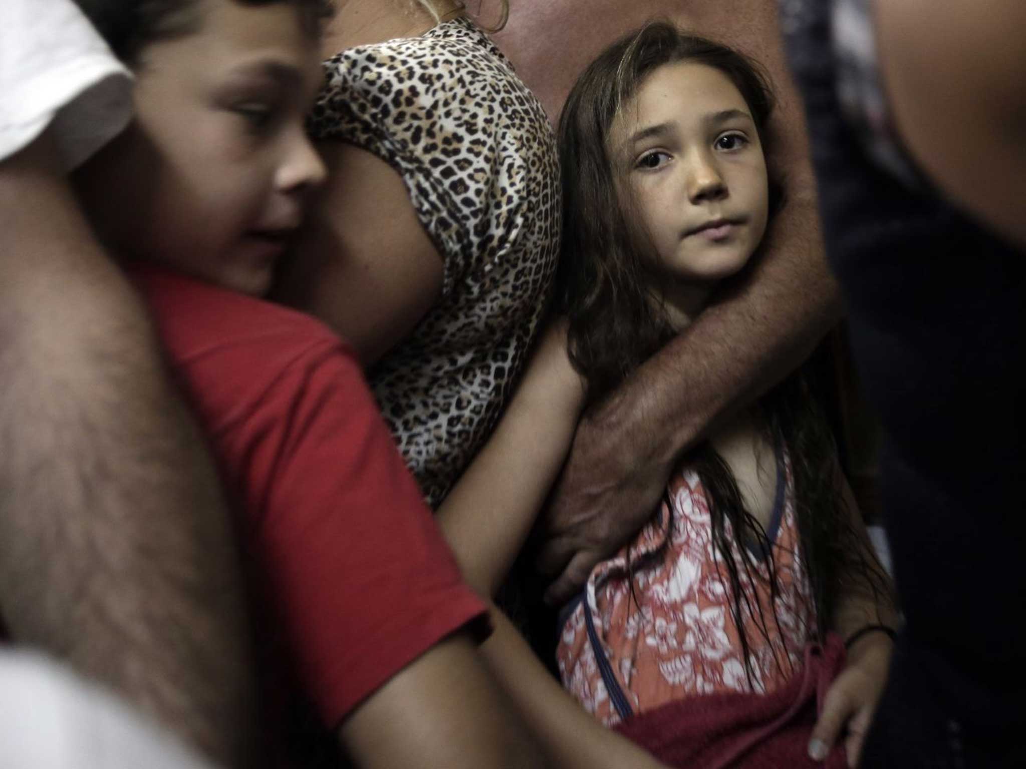 Israeli children take shelter after a rocket warning