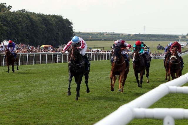 Feel the noise: Slade Power, ridden by Wayne Lordan, lands the July Cup 