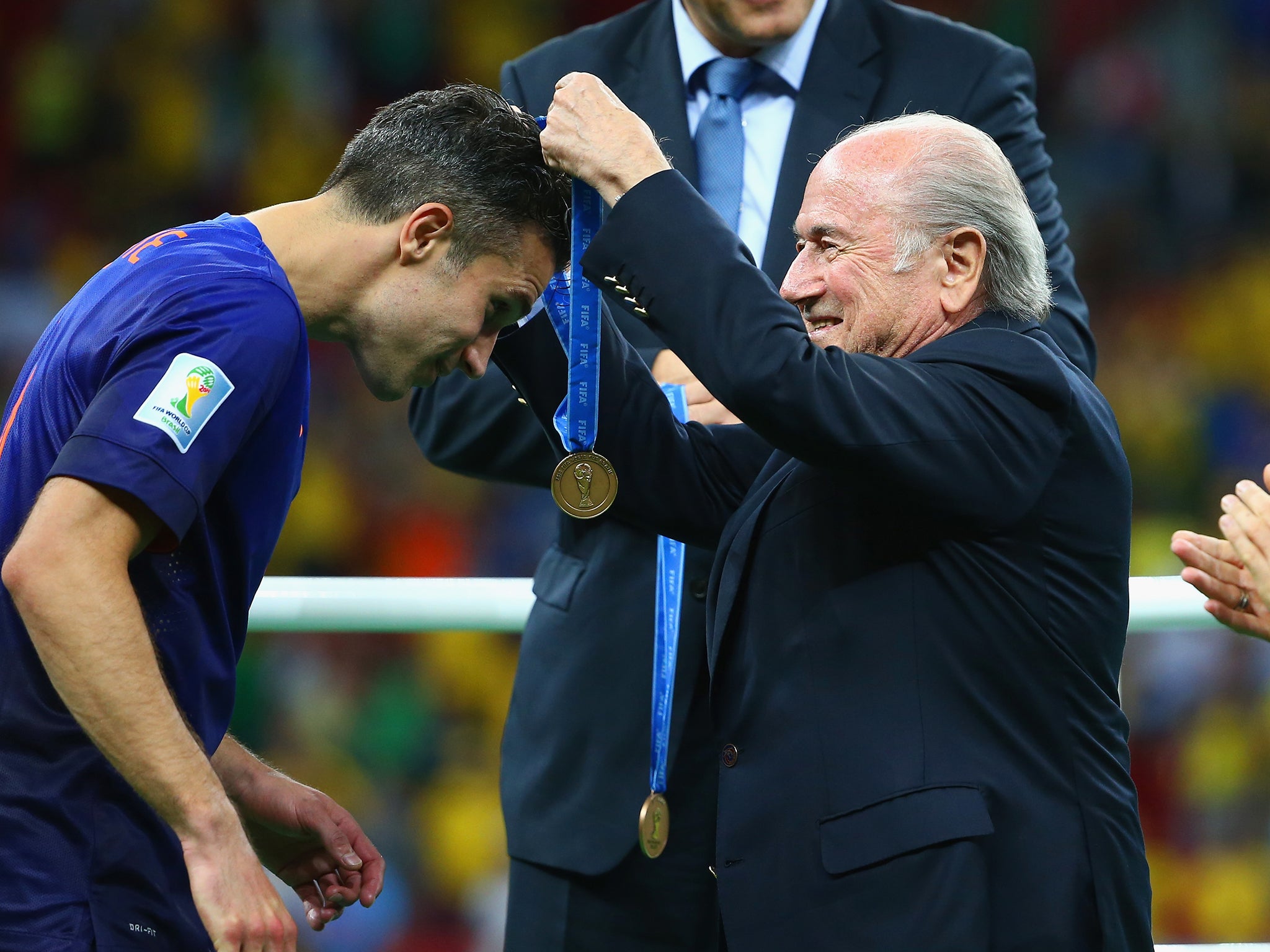 Van Persie is handed his third-place medal by Fifa president Sepp Blatter
