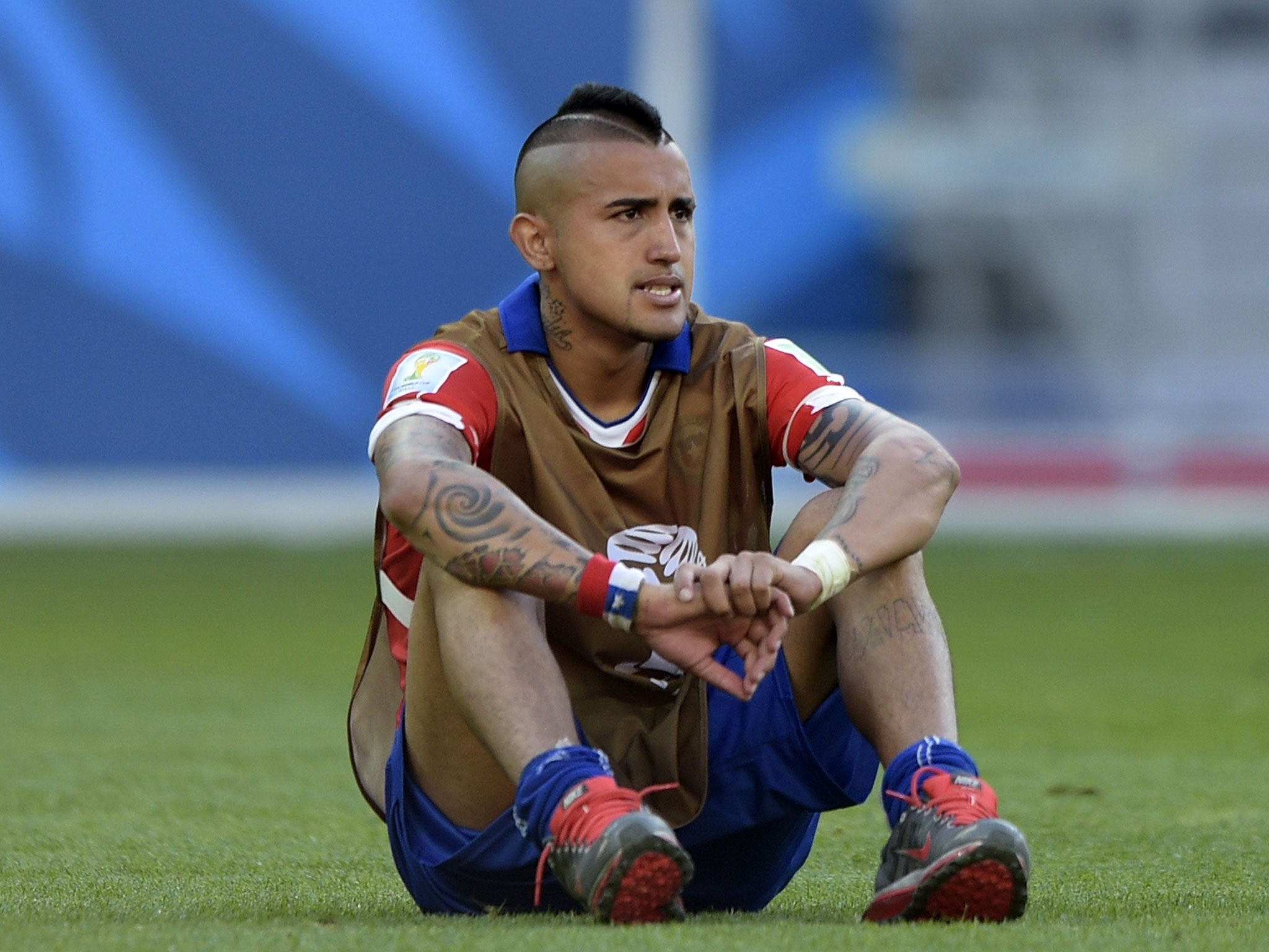 Chile's midfielder Arturo Vidal reacts after losing their match against Brazil in a penalty shoot out after extra-time in the Round of 16 football match between Brazil and Chile