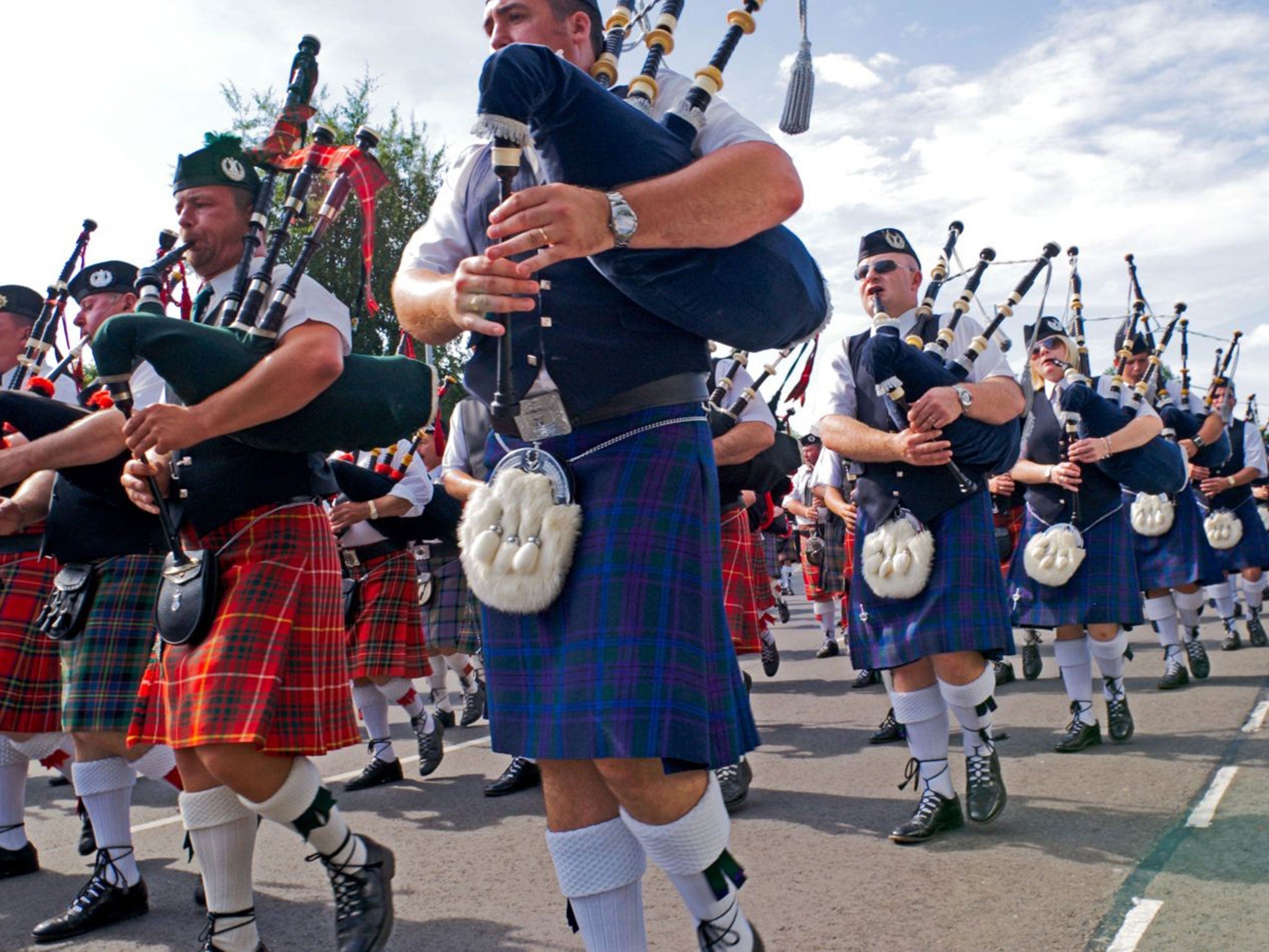 Massed pipe bands at the Highland Gathering Corby Northamptonshire England