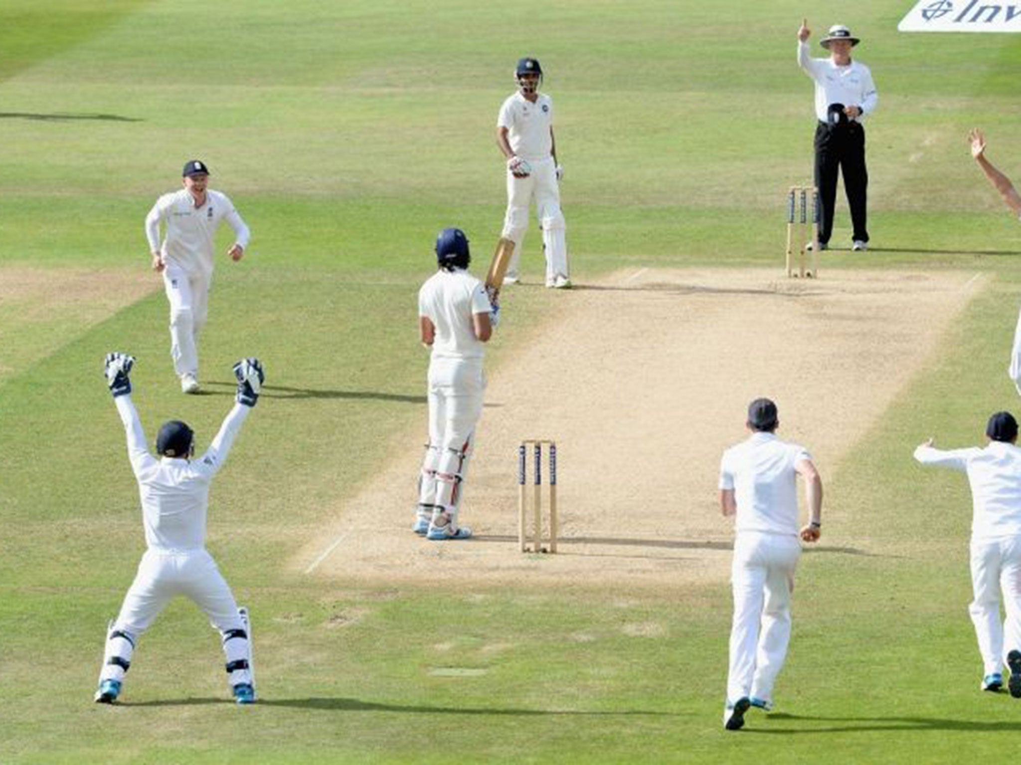England celebrate the dismissal of Ishant Sharma, and Alastair Cook’s first Test wicket, on a largely meaningless day five