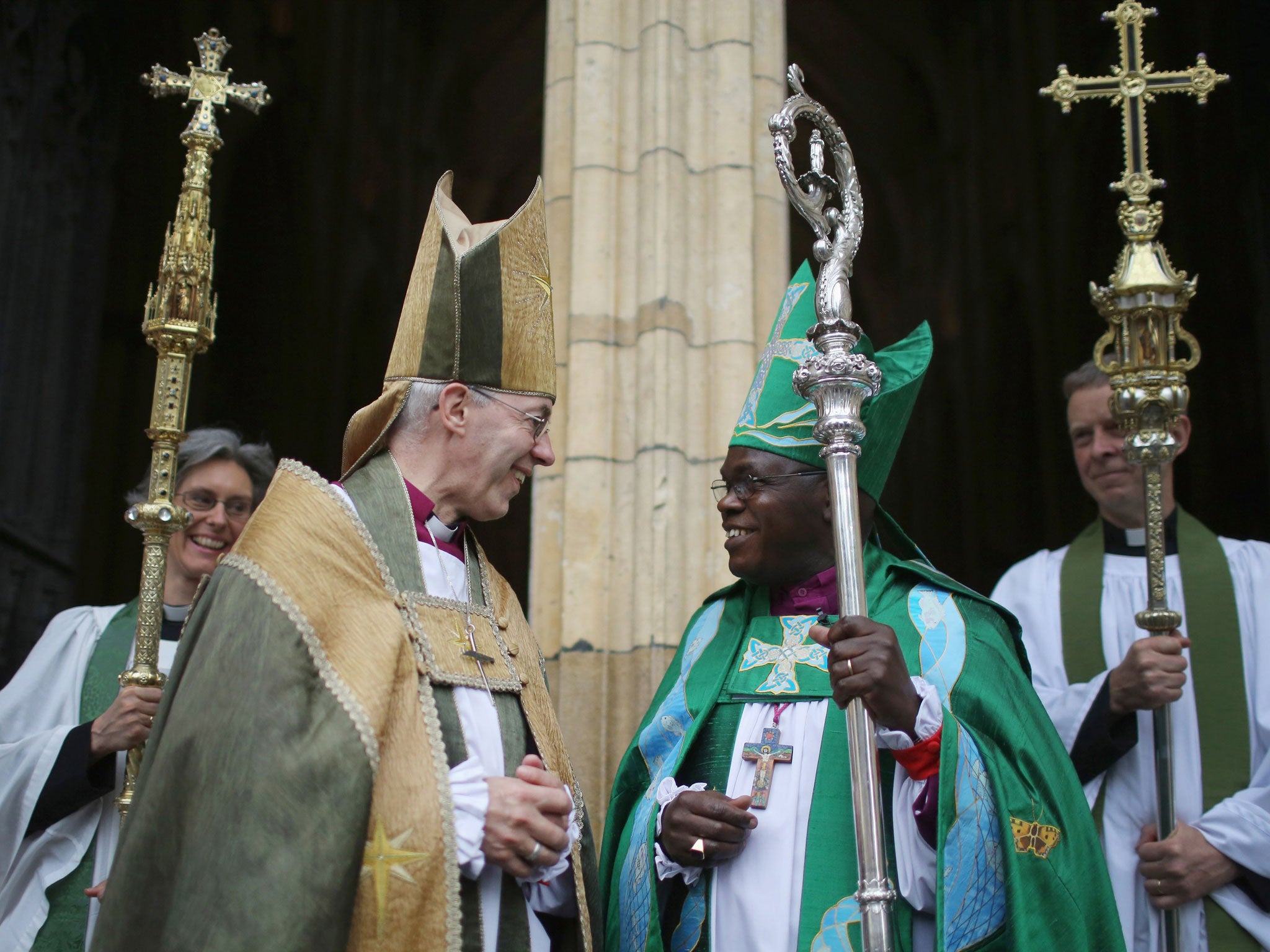 The Archbishop of York John Sentamu (R) and the Archbishop of Canterbury Justin Welby chat on the steps of York Minster after a Eucharist Service on July 13, 2014 in York, England