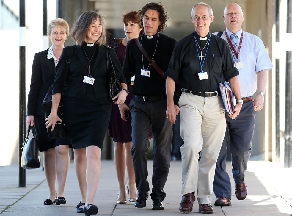 The Archbishop of Canterbury, Justin Welby, second right, and members of the clergy arrive for the General Synod meeting at the University of York on Monday 14 July, 2014