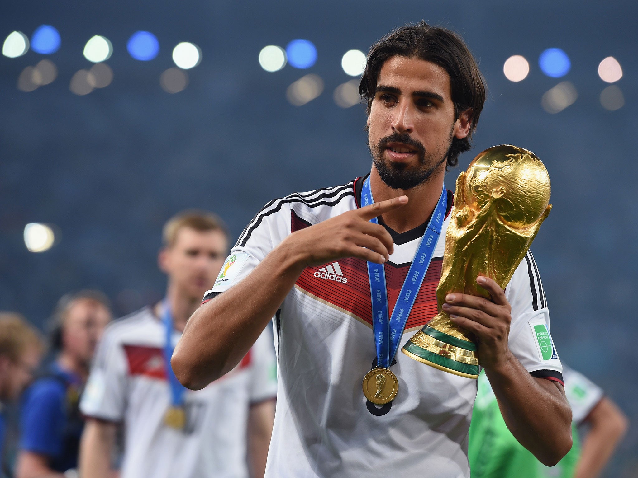 Sami Khedira poses with his World Cup trophy