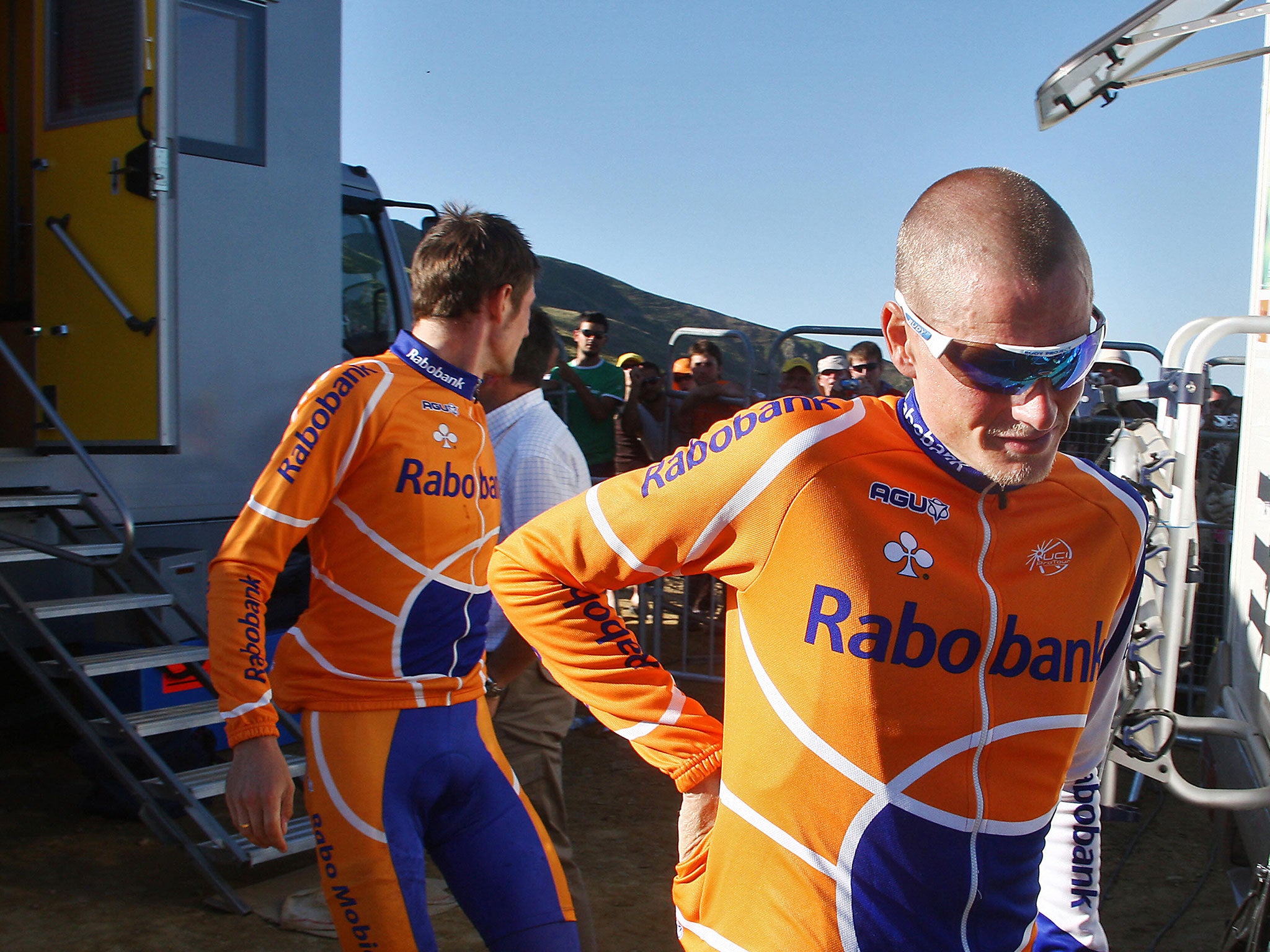Michael Rasmussen (RabobanK/Ned) (R) leaves the anti-doping car control after the 16th stage of the 94th Tour de France