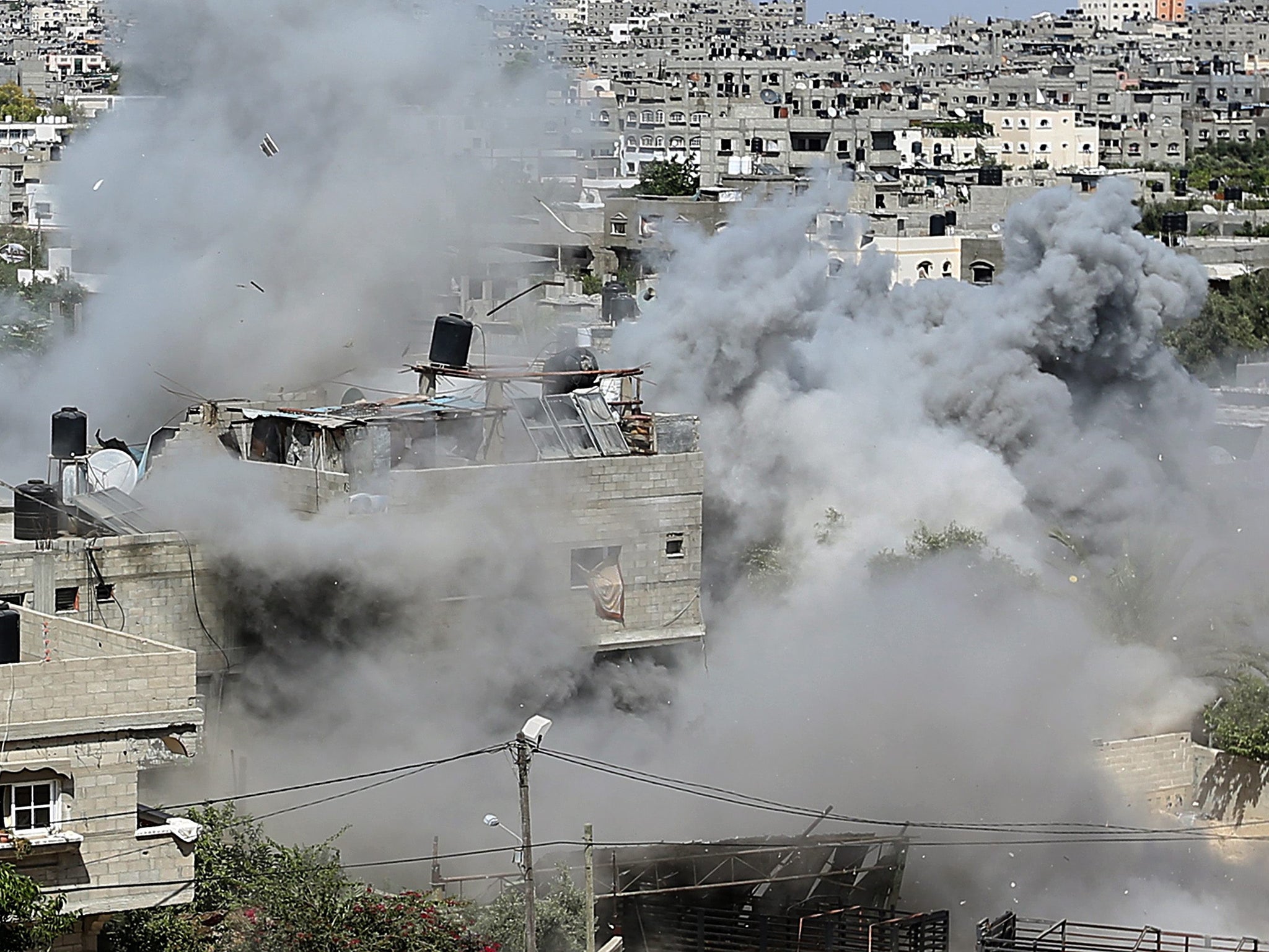 Smoke rises from a Palestinian house during an attack by Israeli missiles in Jabaliya in the northern Gaza Strip