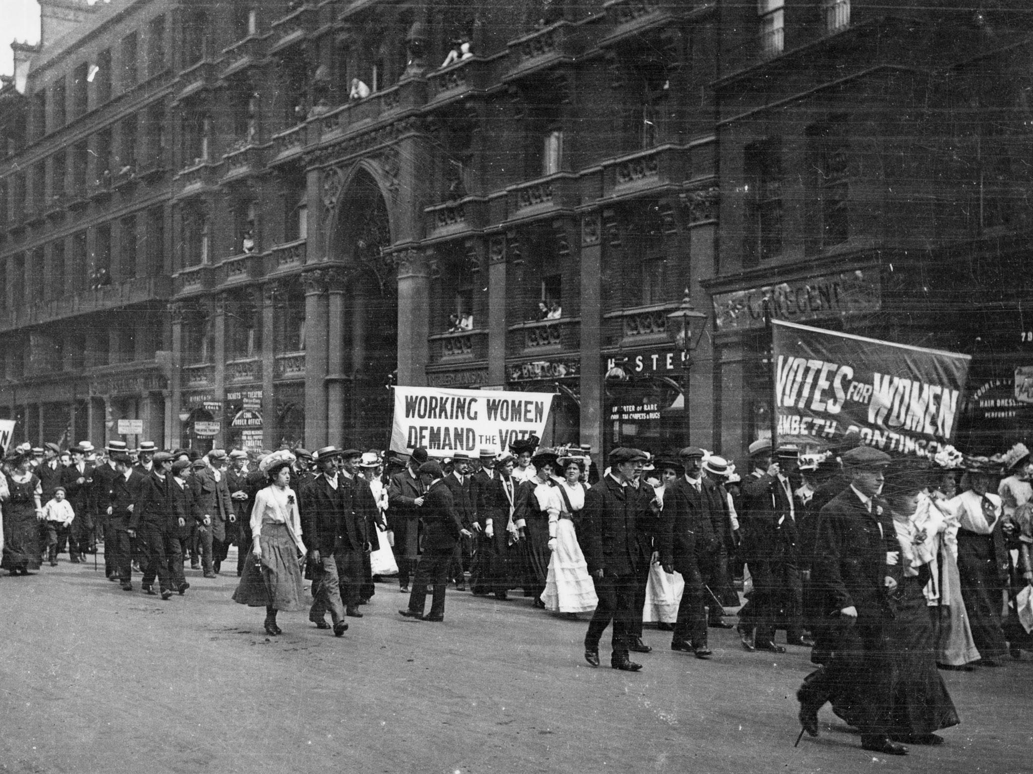 Male and female members of the women's suffrage movement on a protest march through London in 1900