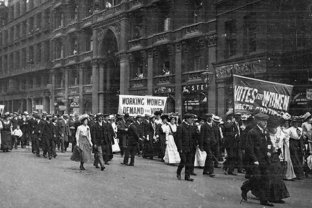 Male and female members of the women's suffrage movement on a protest march through London in 1900
