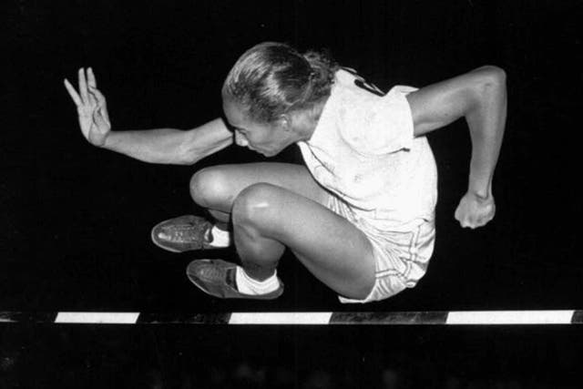 Davis in 1948, on her way to victory at a meet in Iowa; she was banned from using public sports facilities