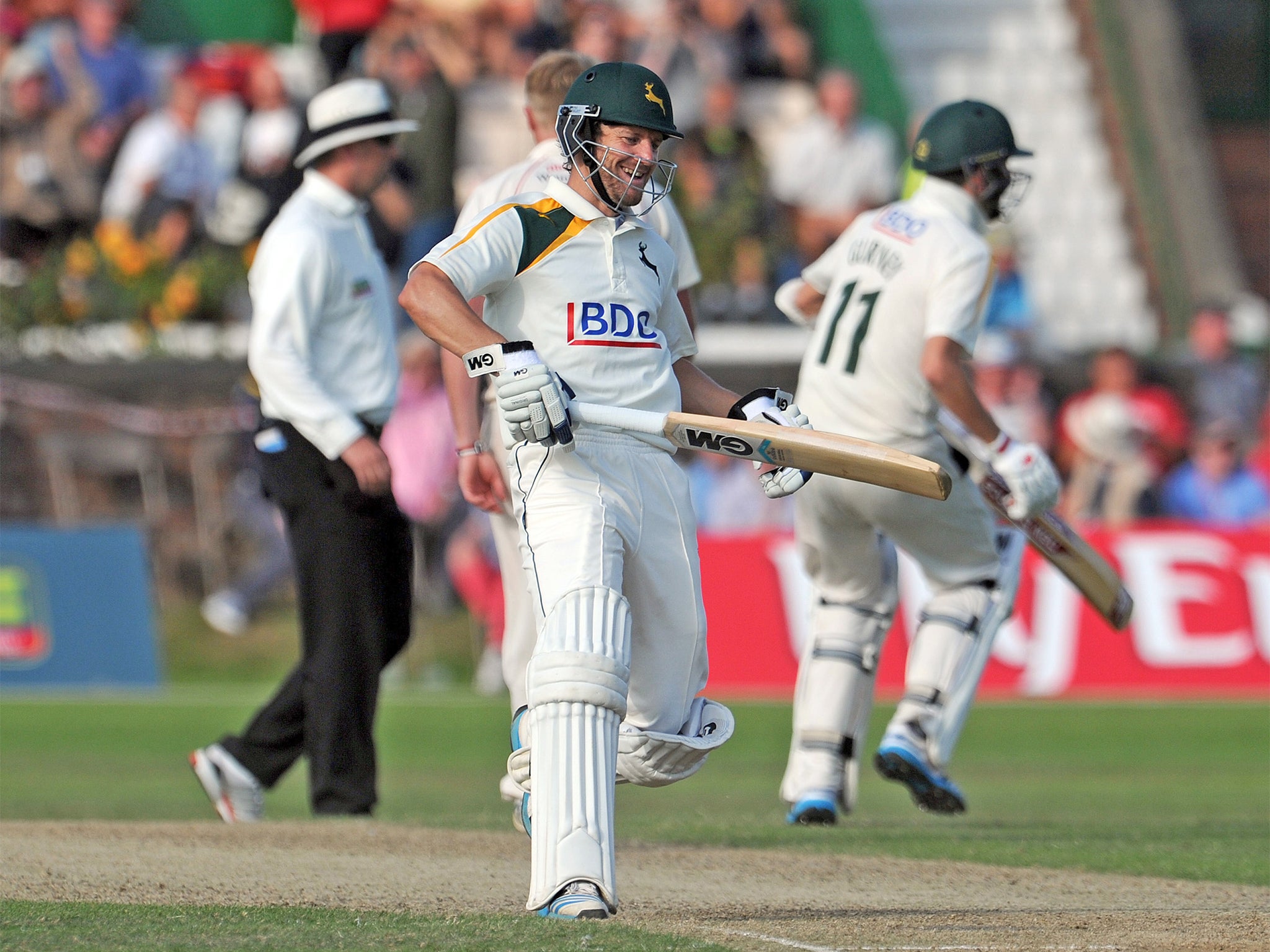 Chris Read (centre) celebrates after Harry Gurney (right) scored the winning run for Notts