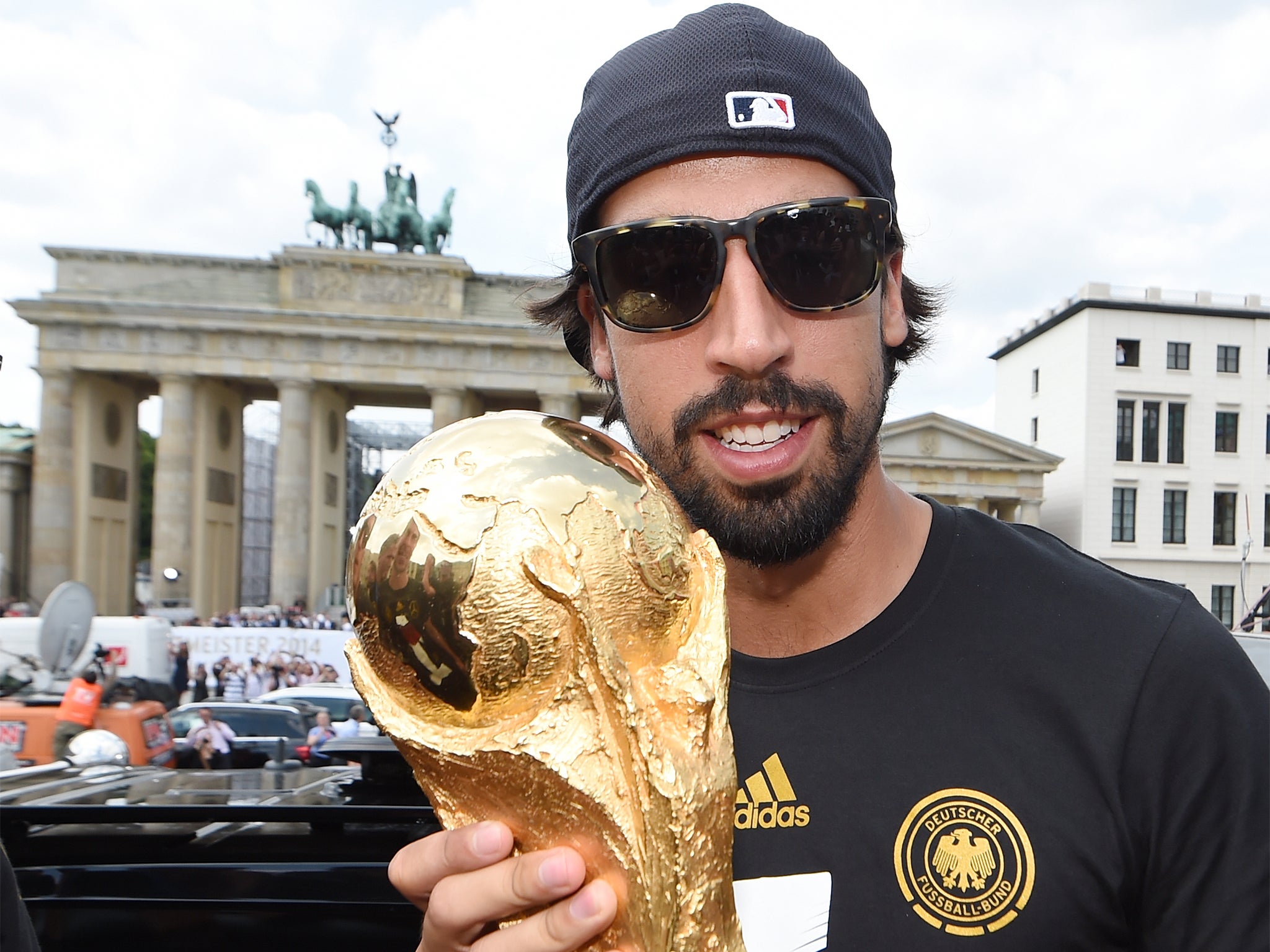 Sami Khedira holds the World Cup trophy