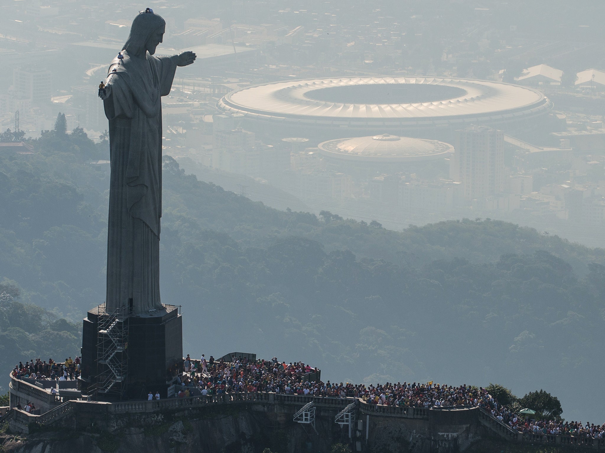 The Maracana can be seen behind the iconic Christ the Redeemer statue that overlooks Rio de Janeiro