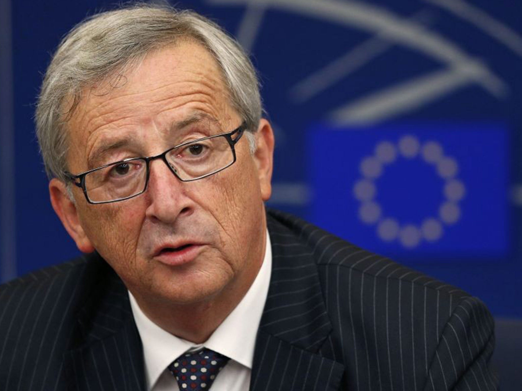 Elected president of the European Commission Jean-Claude Juncker answers journalists questions during a press briefing after his election at the European Parliament in Strasbourg, July 15, 2014.