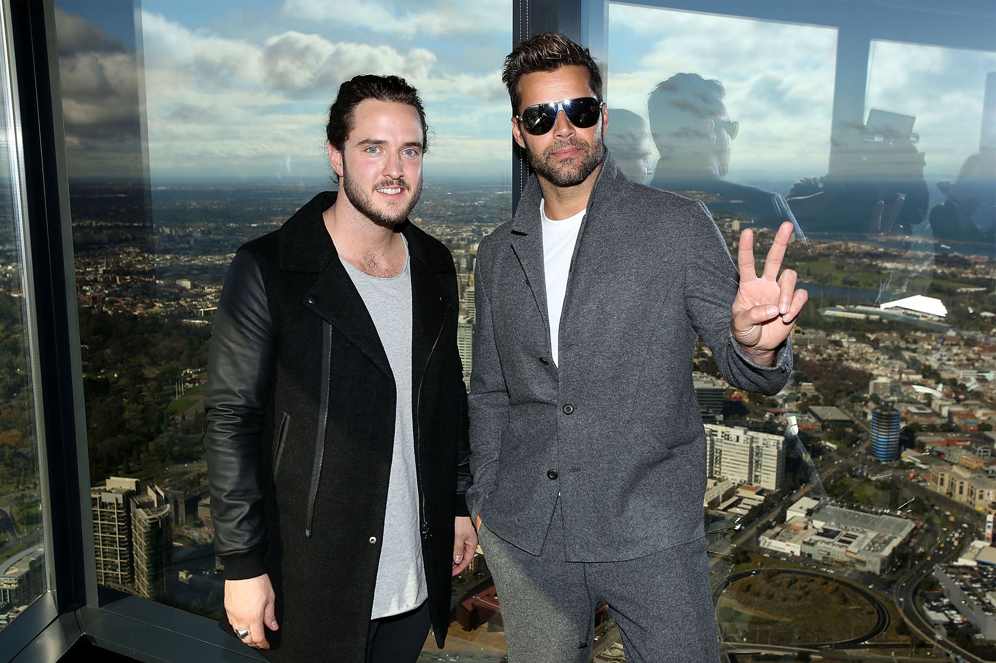 Ricky Martin posing with his slightly shifty looking The Voice Australia finalist in Melbourne