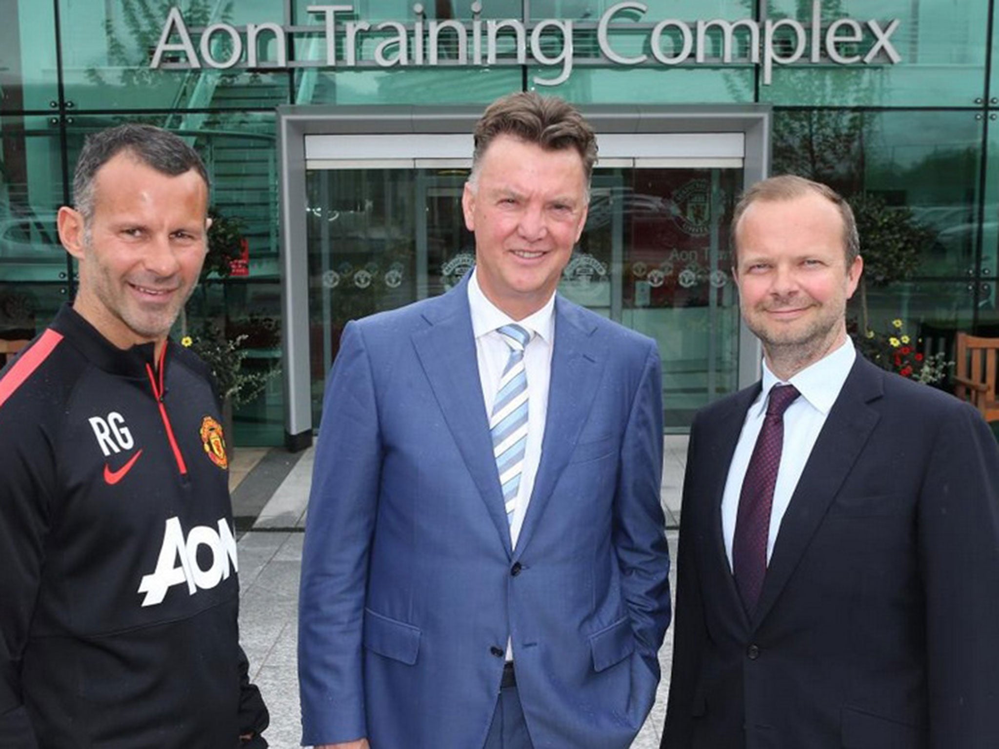Louis van Gaal at United's training ground today alongside assistant manager Ryan Giggs and vice-chairman Ed Woodward