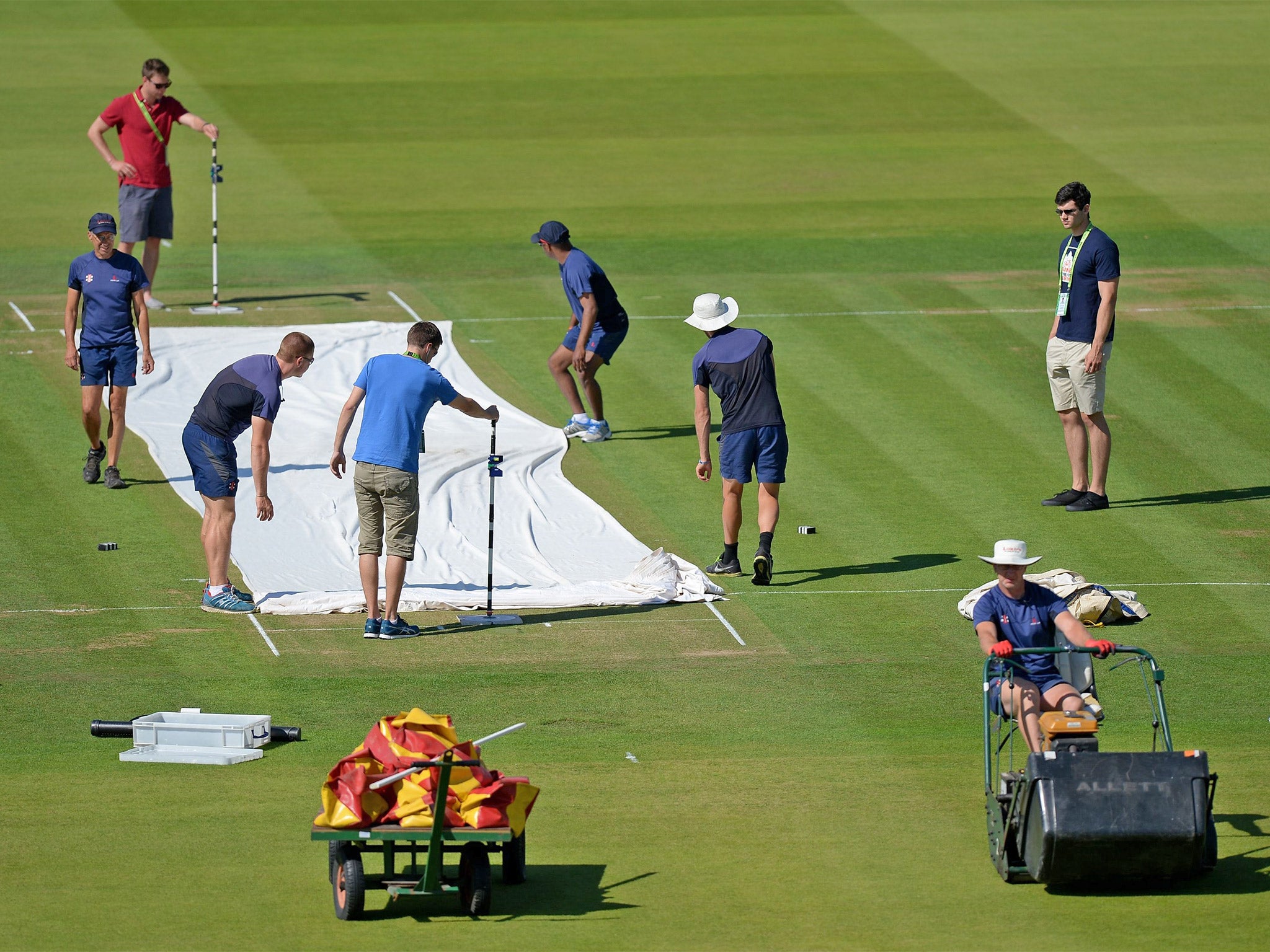 Ground staff prepare the Test wicket at Lord's