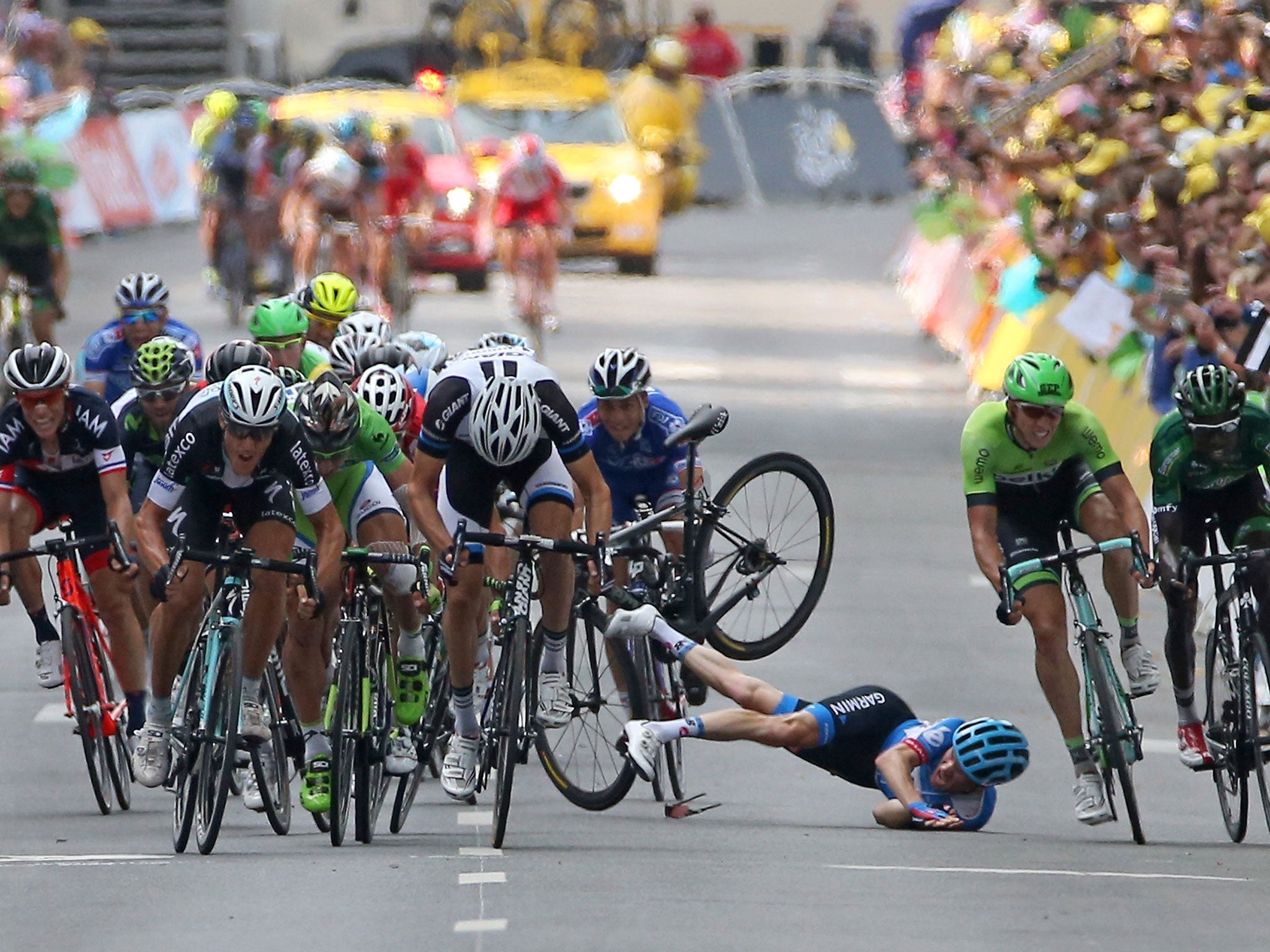 Andrew Talansky of the United States and Garmin-Sharp crashes in the sprint to the finish line in stage seven of the 2014 Le Tour de France