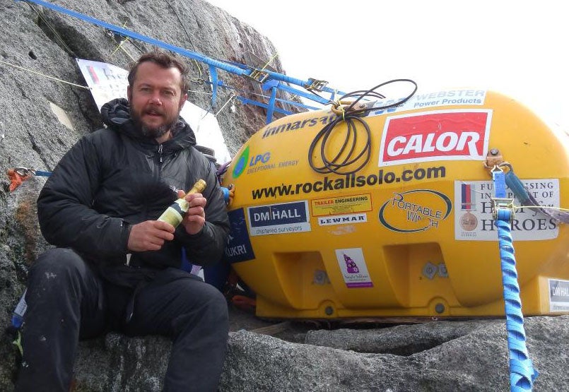 Nick Hancock, celebrates with a mini bottle of champagne after spending 40 days alone on Rockall